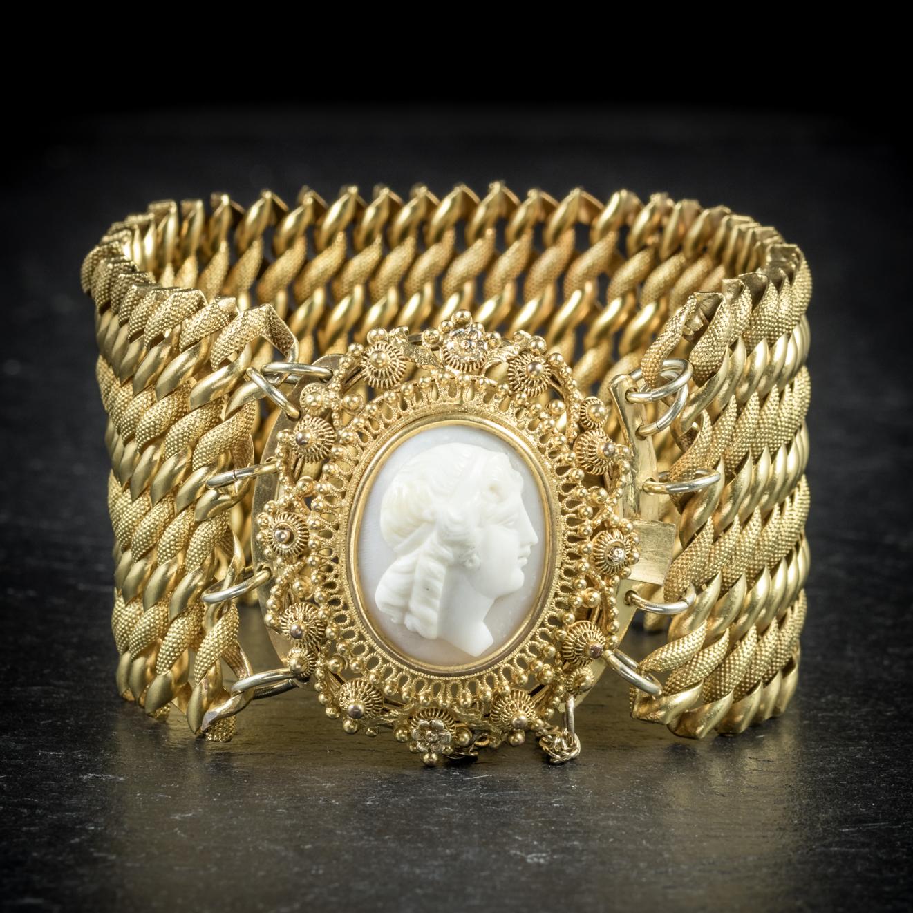 This rare antique Pinchbeck, Cameo bracelet is from the Georgian era, Circa 1810

The piece comprises of a large Pinchbeck band which is articulated and fitted with a beautiful  clasp complete with safety chain

The clasp is set with a lovely