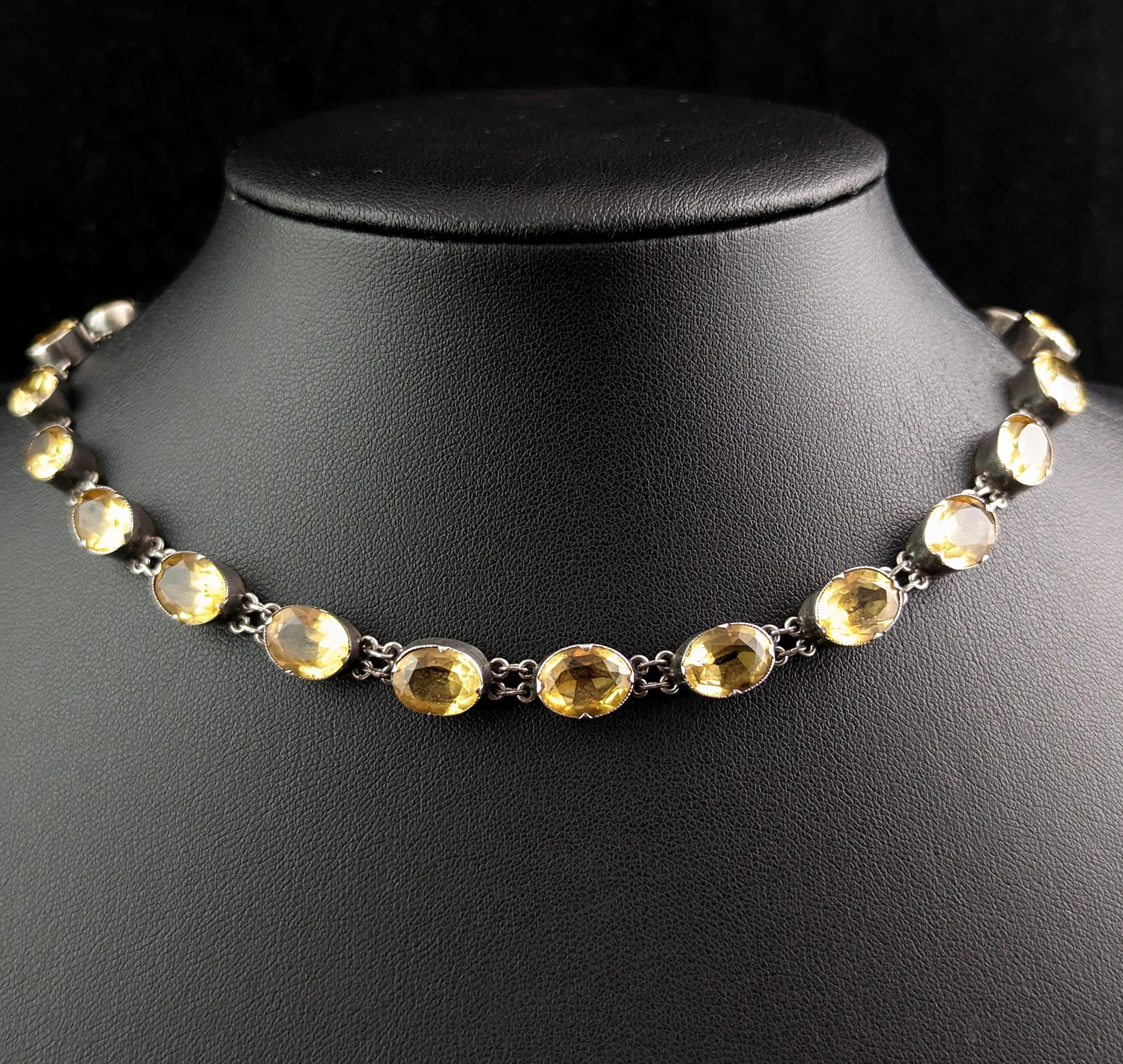 An antique Riviere necklace is certainly a wonderful addition to any antique jewellery collection and this wonderful early 19th century citrine example is no exception!

She is made from sterling silver set with pretty graduated citrine stones, each
