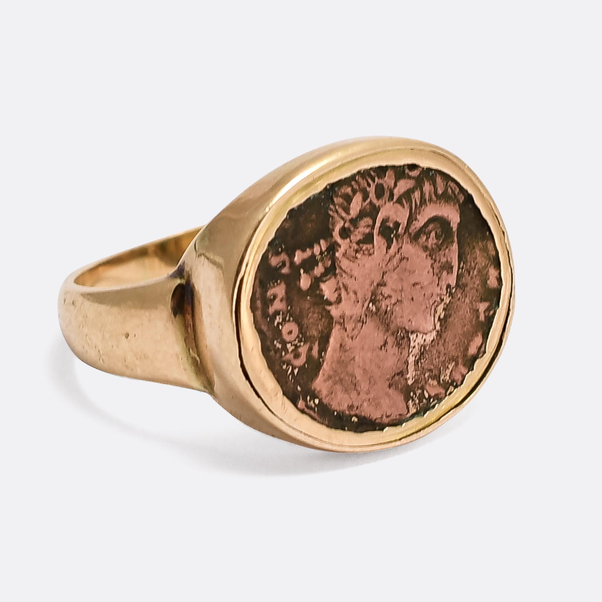 An exceptional Georgian signet ring set with a 4th century Roman coin. The coin is a bronze follis (AE4) and was minted for Constantine The Great, circa AD 320. It's set into an elegantly proportioned 18k gold ring mount that dates from the very
