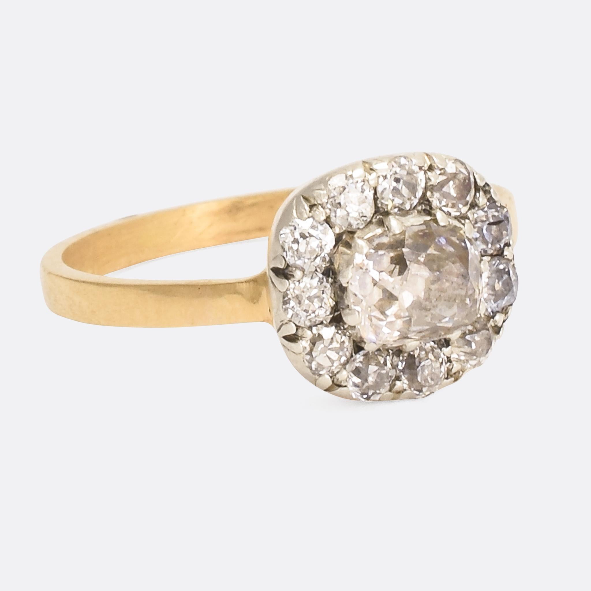 A stunning .67ct cushion cut diamond forms the centrepiece of this antique cluster ring. The head is cushion shaped, matching the central stone, and set with a further 11 old mine cut stones. We've opened up the back making it ideal for every day