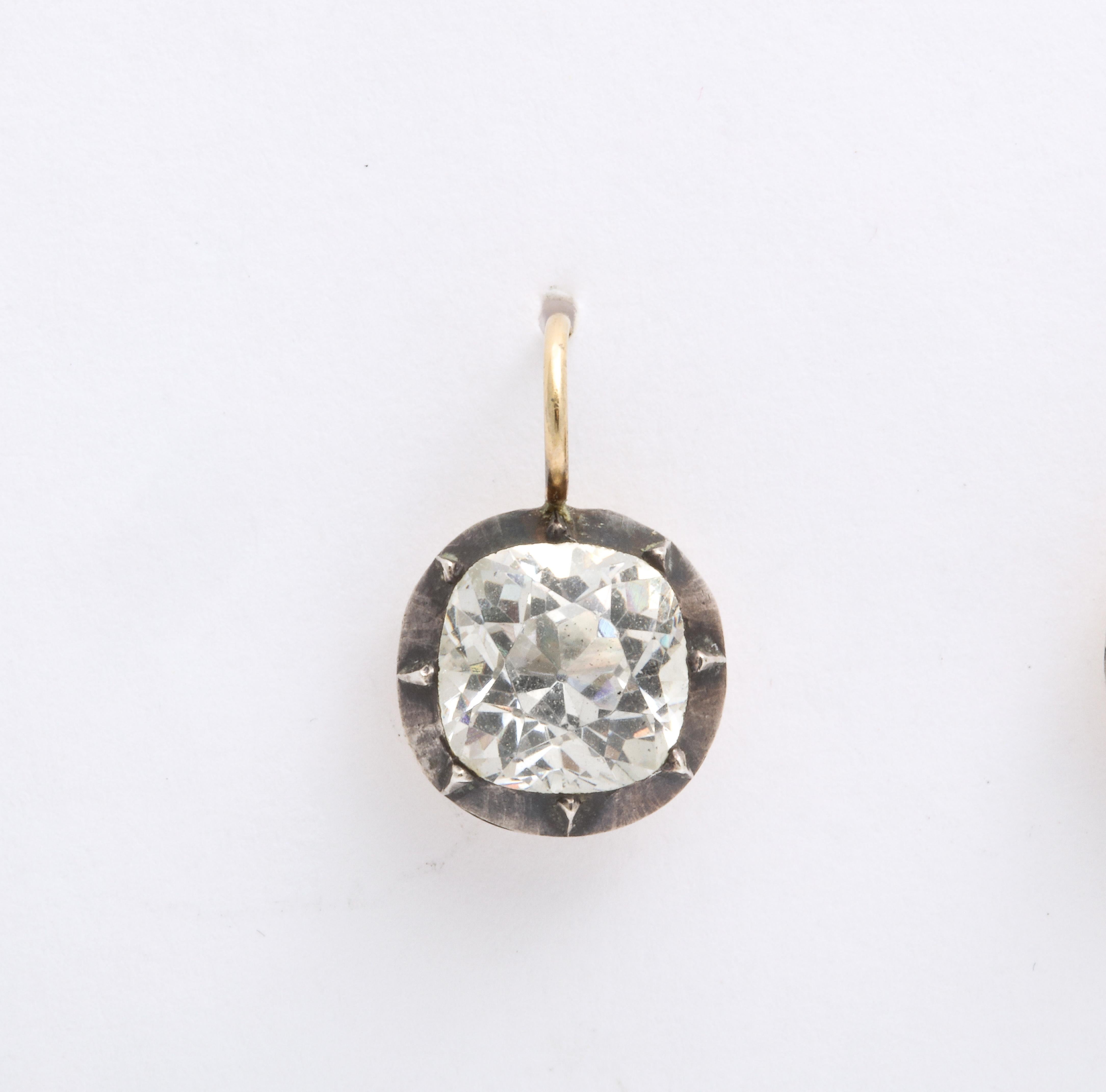 Authentic hand crimped setting are frames for brilliant foiled paste stones of 2.25 cts. The pastes are especially radiant and winning. Earrings like these original drops can be worn everyday, every way. All paste earrings were originally a necklace