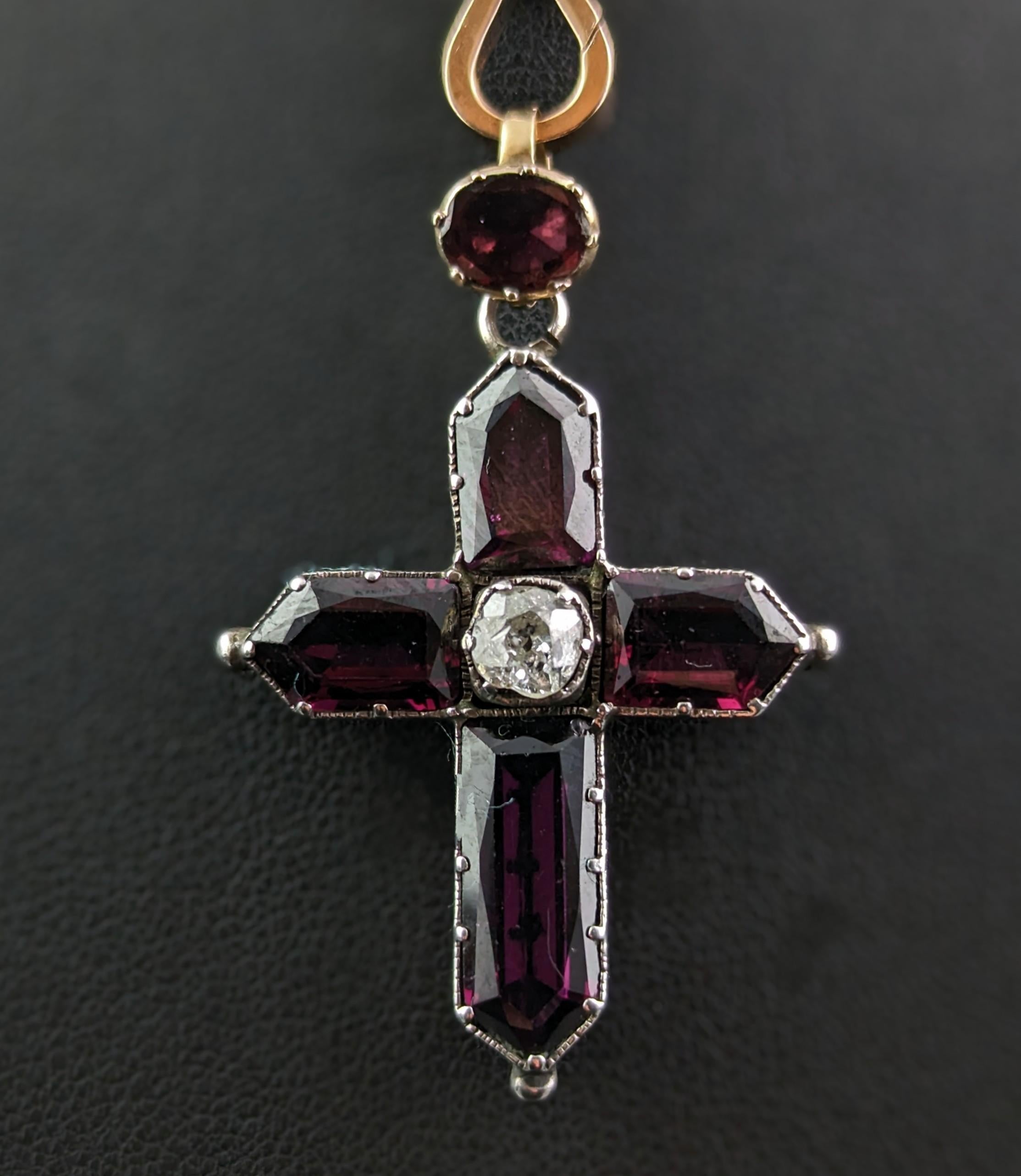 This Antique Georgian Cross pendant is just mesmerising.

A truly stunning and fine piece of antique jewellery, Georgian era, it exudes that rich mystical sparkle that you can only find in Georgian pieces.

It is a Cross pendant,crafted in sterling