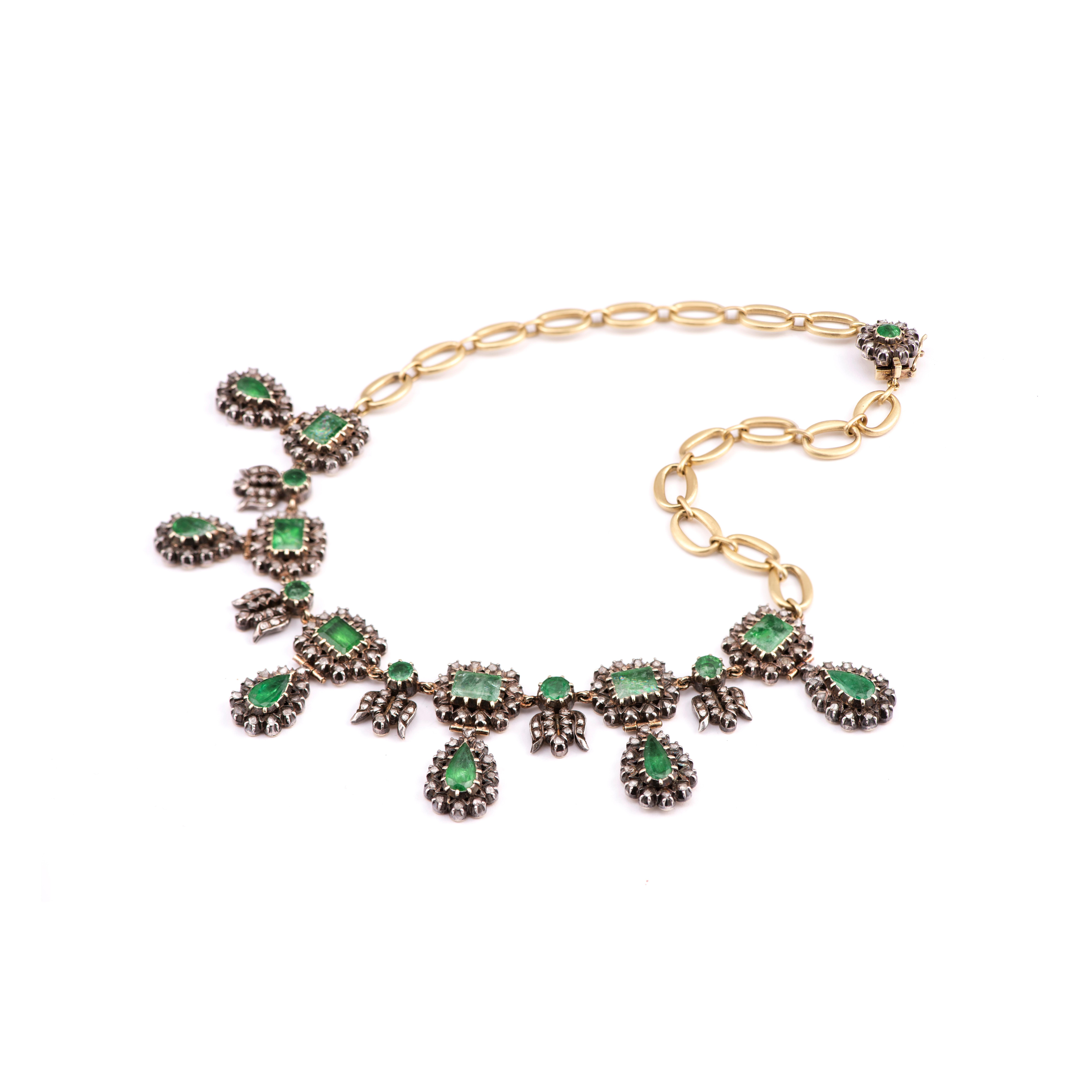 A stunning antique Georgian Era necklace that has been brilliantly re-designed into a contemporary necklace with signature handmade 18k yellow gold O-links and Georgian detail clasp.  

Diamond and Emerald carat weights are unknown.  17.5 inches