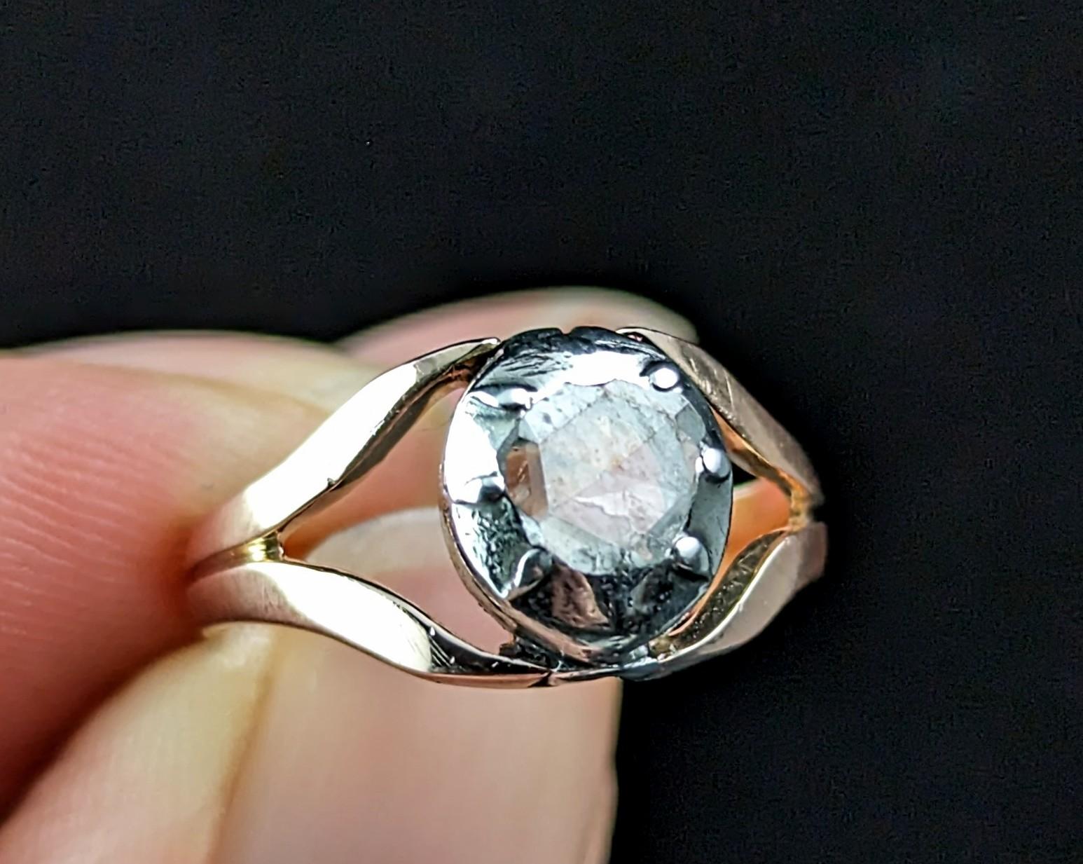 You cannot help but be enchanted by this superb antique rose cut diamond conversion ring.

A beautiful late Georgian era rose cut diamond bezel set into sterling silver and added to a later 9ct rose gold bifurcated band.

The romantic twinkling rose
