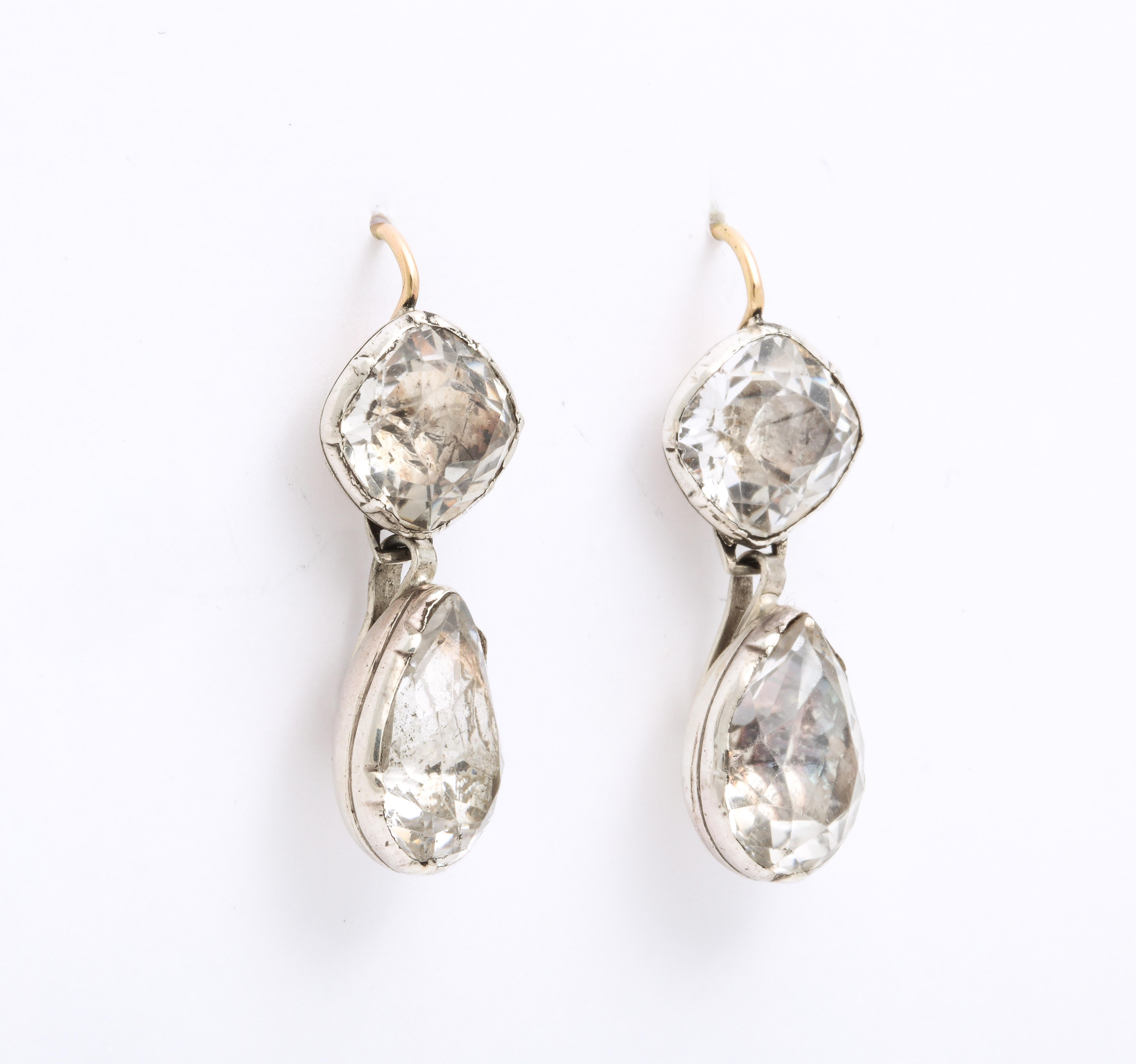 Magnificent, rare in size and glow, these Georgian foiled rock crystal earrings are set in their rounded closed foiled backs and shine brilliantly in sunlight or darkness. These earrings are a treasure of jewelry history and show what the royal love