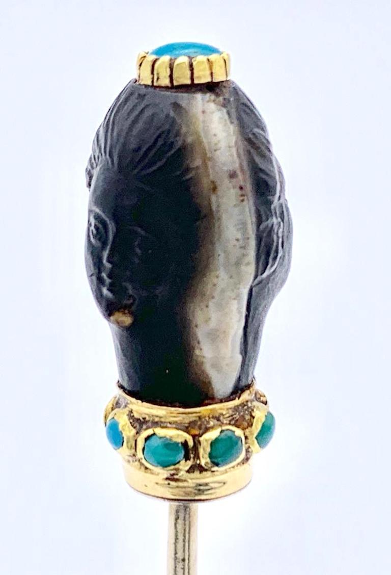 Very rare early 18th century double headed stick pin carved out of sardonyx. The double sided carving is mounted in 14k gold and decorated with gold set turquoises. The pin is made out of 9k gold. 
