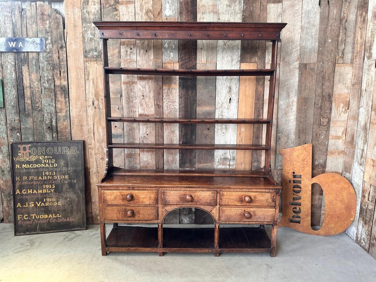 Antique Georgian Oak Welsh Country Dog Kennel Dresser, circa 1790

A magnificent solid oak Georgian dresser, dating from the late 18th century. Original plate rack with base, not a marriage. Professionally restored to a functional and clean example,