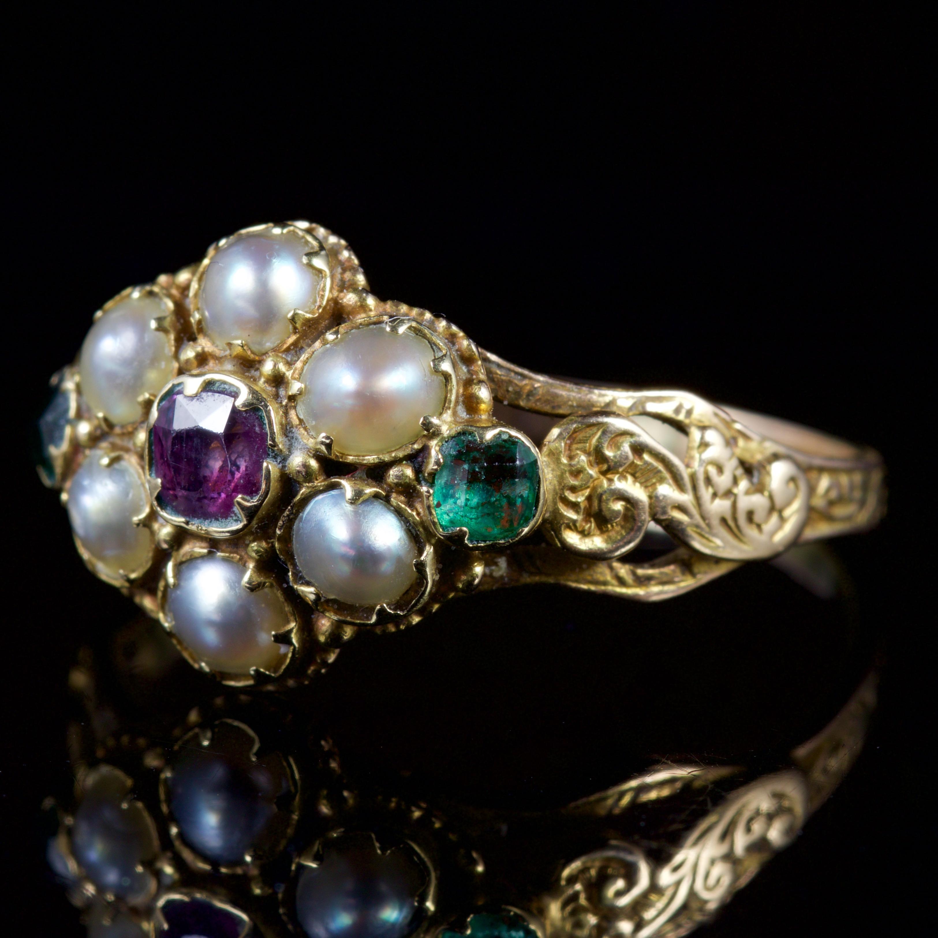 This adorable Georgian ring is set in 18ct Yellow Gold, Circa 1800.

The ring is set with a Almandine Garnet in the centre which is surrounded by a halo of creamy Pearls with a deep, green Emerald on each shoulder.

Almandine Garnet’s are known as