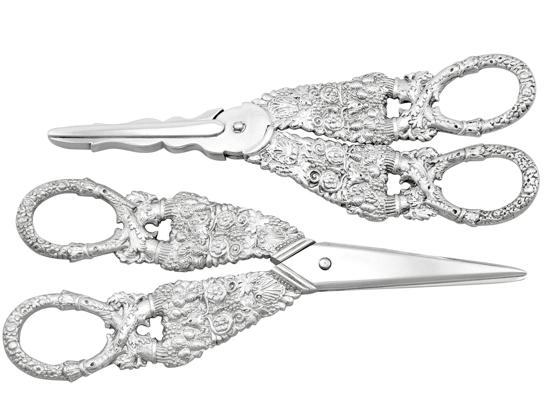 An exceptional, fine and impressive, composite pair of antique George IV English sterling silver grape shears; an addition to our silver flatware collection.

These exceptional antique sterling silver grape shears have a hinged scissor action.

The