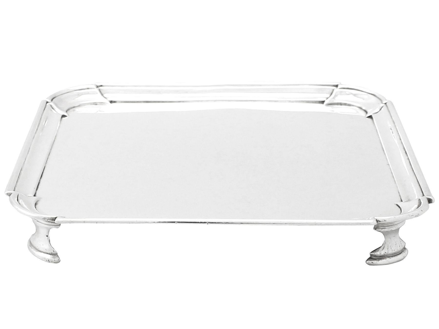 An exceptional, fine and impressive antique Georgian English sterling silver salver; an addition to our dining silverware collection.

This exceptional antique George II sterling silver salver has a plain square shaped form with rounded incurved