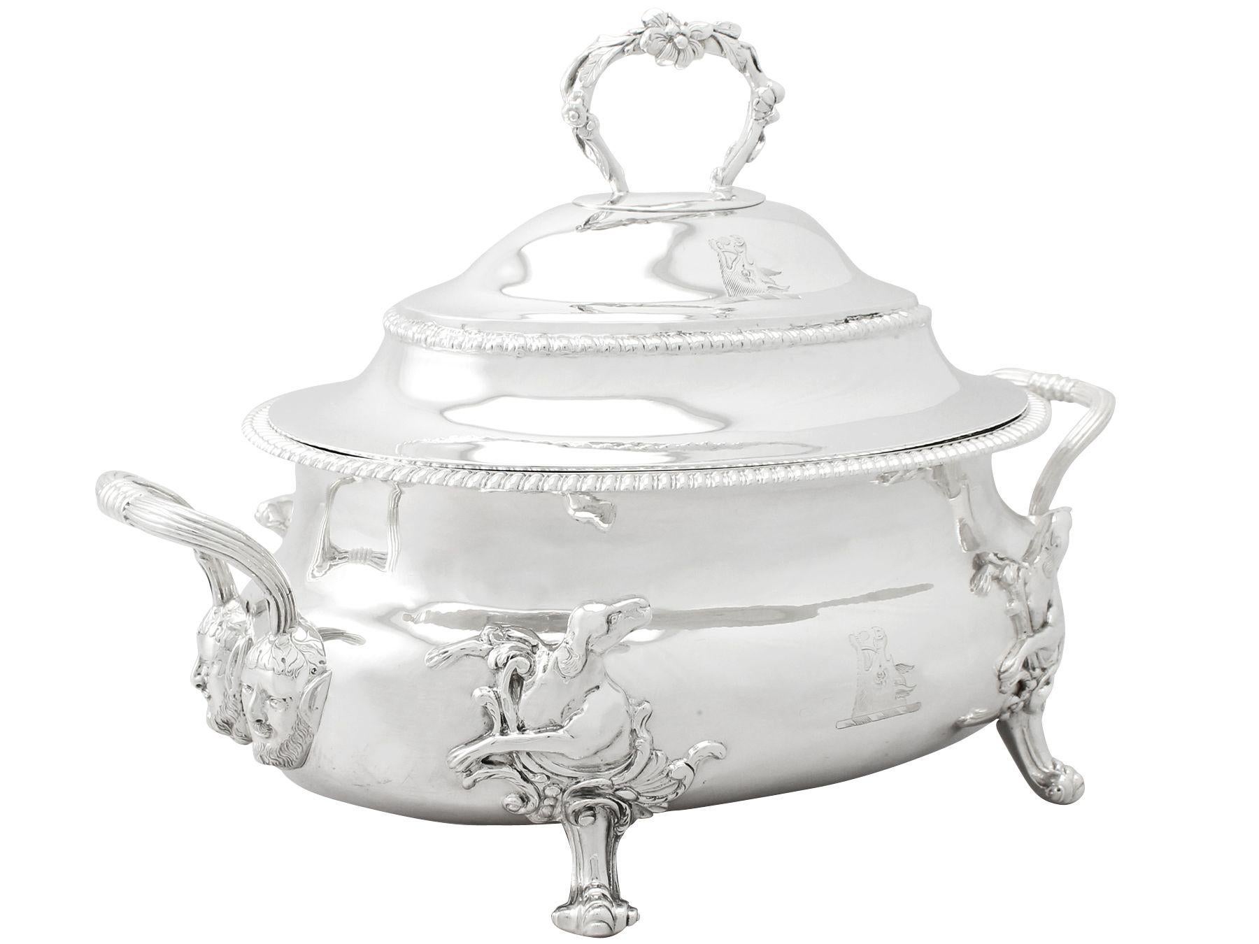 An exceptional, fine and impressive antique Georgian English sterling silver soup tureen; an addition to our dining silverware collection.

This exceptional antique George III English sterling silver soup tureen has an oval rounded form.

The