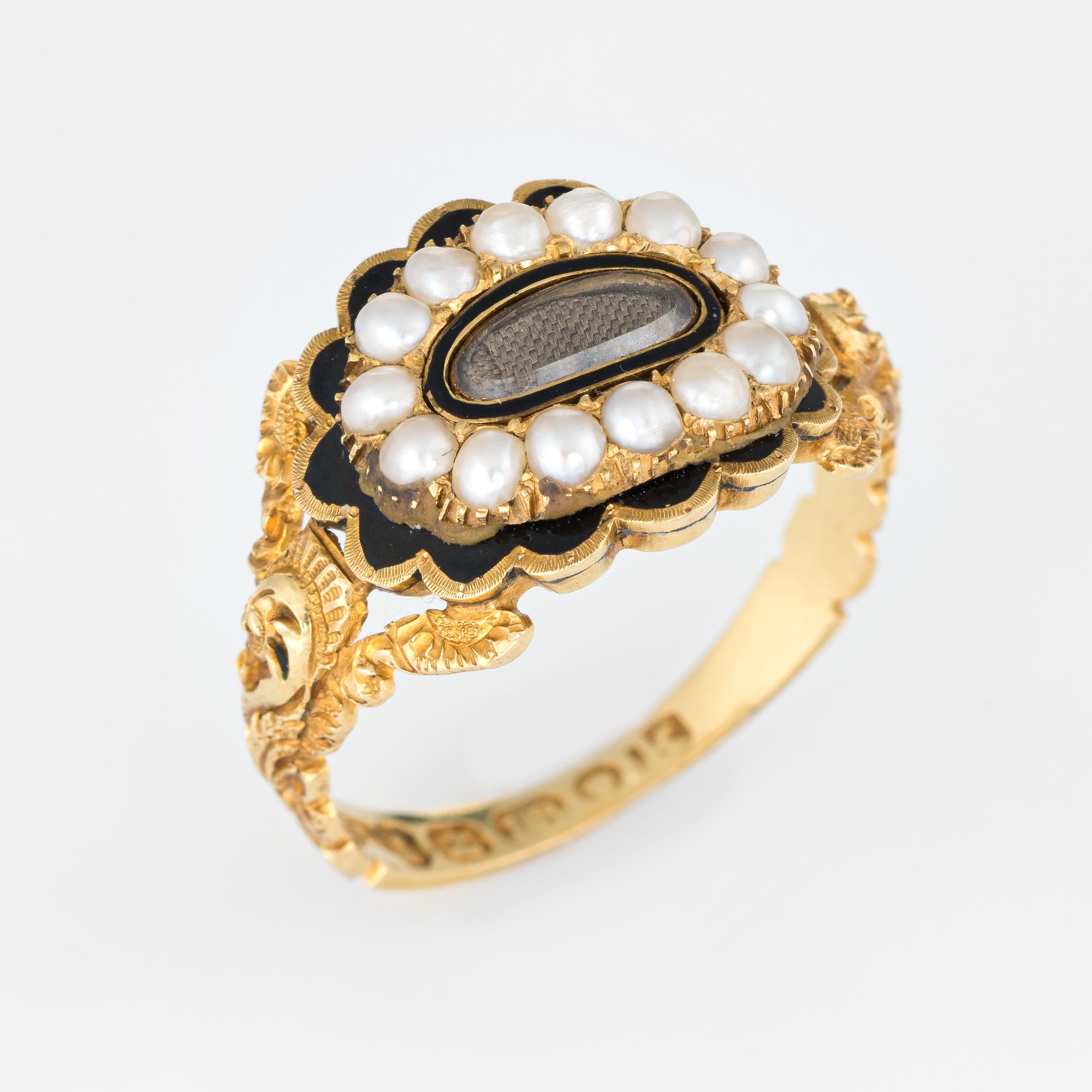Antique Georgian era memorial ring (circa 1825) crafted in 18 karat yellow gold. 

Natural pearls measuring (average) 2.5mm border an oval compartment that holds natural hair. The pearls are in very good condition showing good luster. The glass case