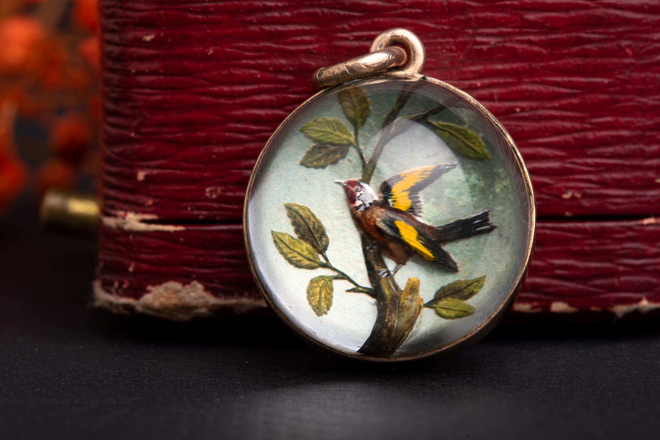 An absolutely superb and very detailed gem. One of the best Essex crystal memento mori jewels we have seen.

An extremely rare and beautifully colored reversed intaglio depicting a very detailed goldfinch perched on a branch.
Amongst all flora and