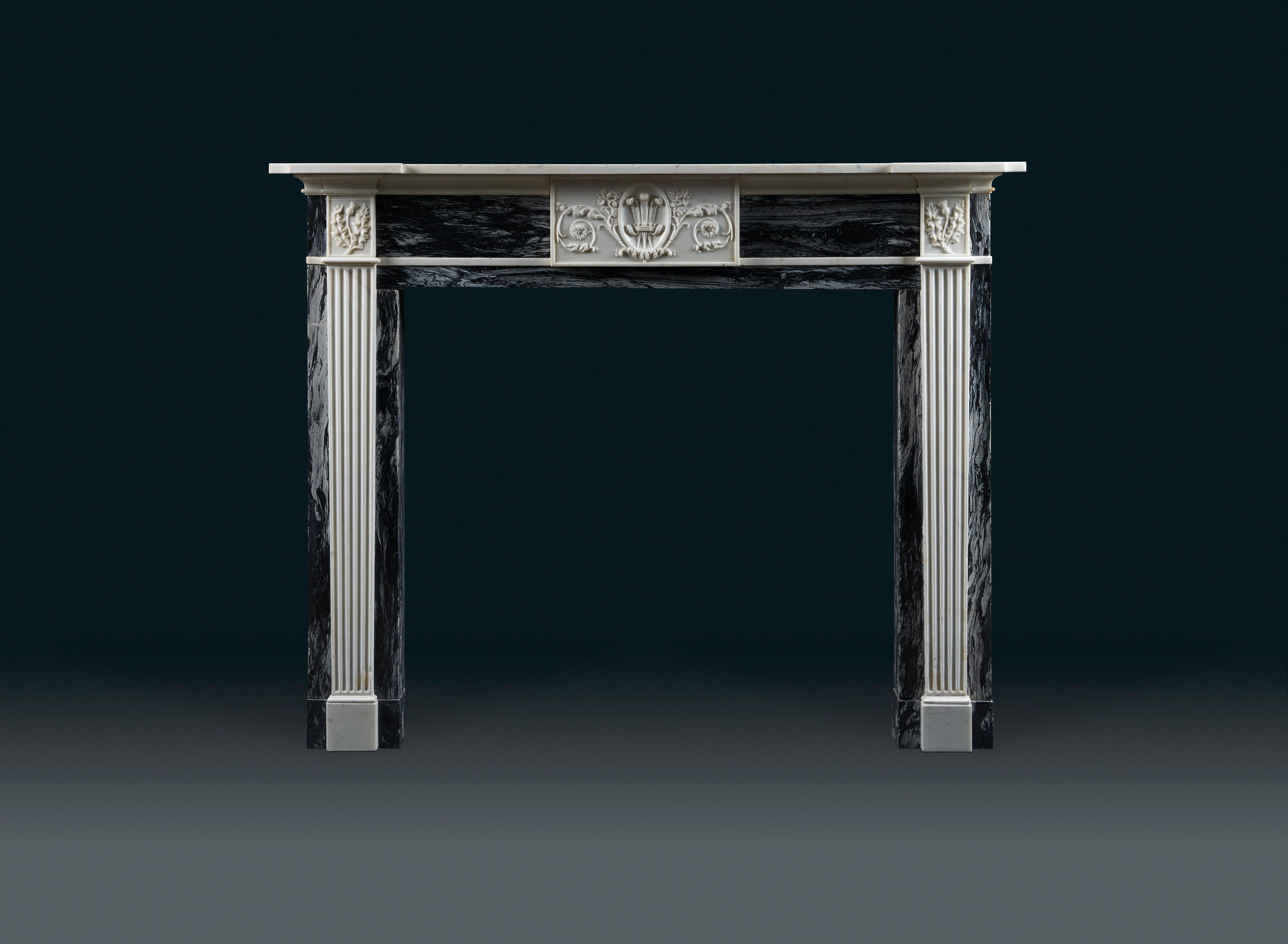 An attractive late 18th century, Scottish chimneypiece of statuary and variegated grey and black flecked marbles, circa 1795. Originally from Thriepley House, Scotland
With simple breakfront shelf above the frieze which is centred with a finely