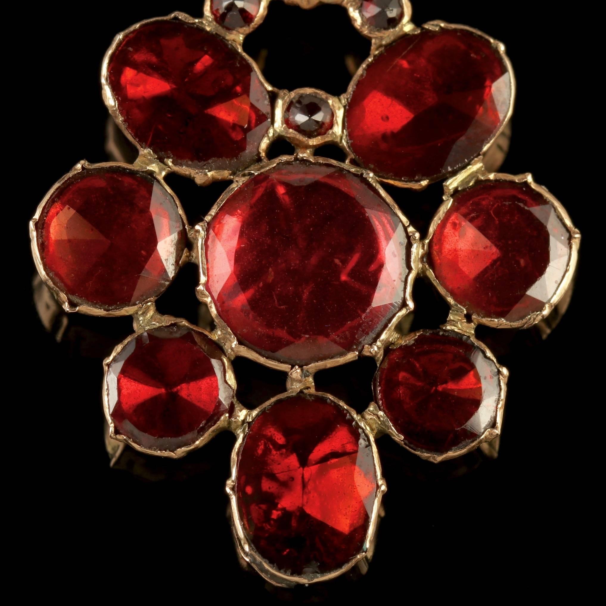To read more please click continue reading below-

This beautiful antique 18ct Gold Georgian Flat cut Garnet Pendant is Circa 1770.

The wonderful pendant is adorned with stunning flat cut Garnet’s, the largest of which is 2ct in size.

The Garnet
