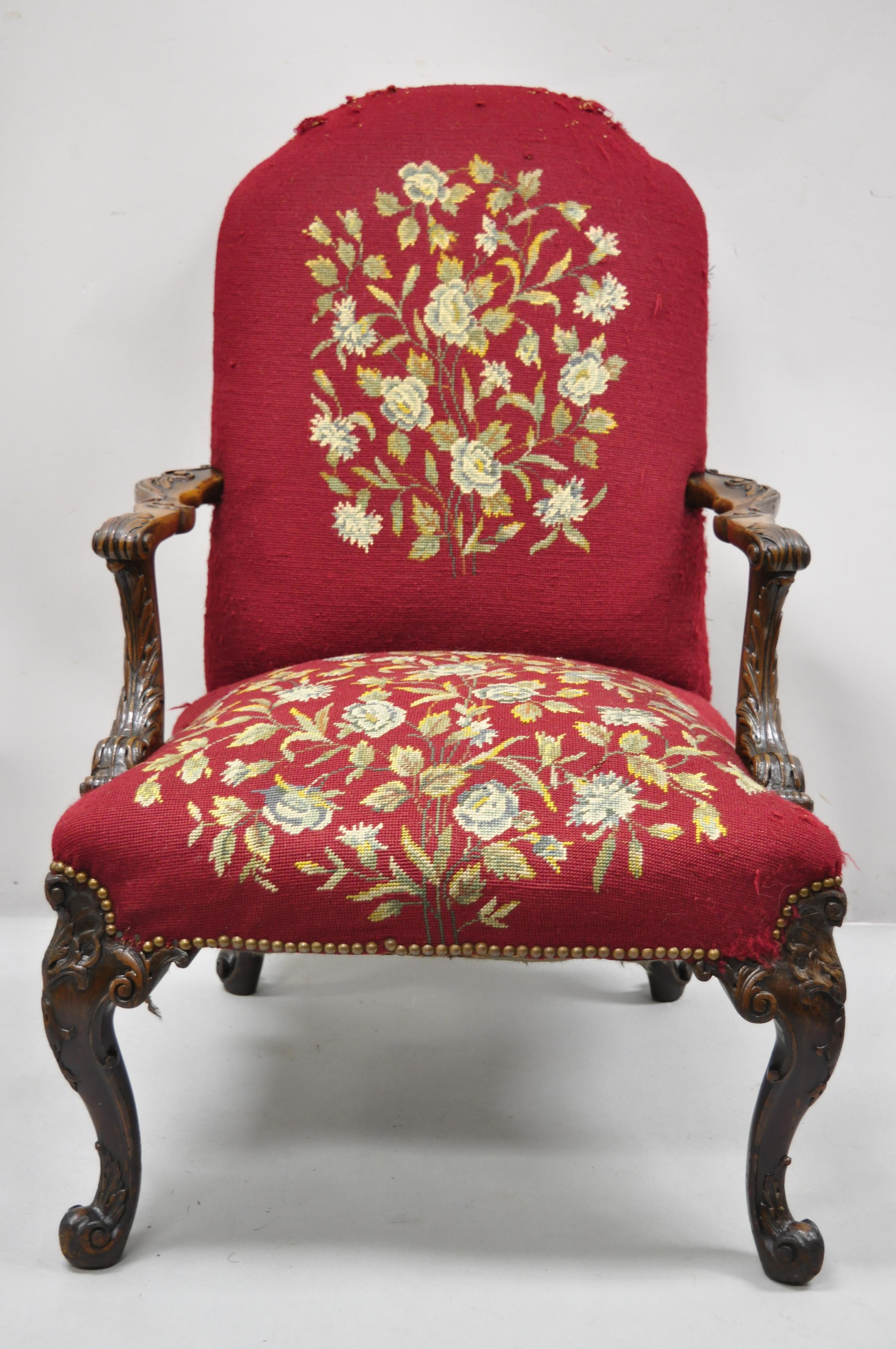 Antique Georgian floral needlepoint carved mahogany fireside lounge arm chair. Item features red floral needlepoint upholstery, solid wood frame, nicely carved details, cabriole legs, very nice antique item, quality craftsmanship, great style and