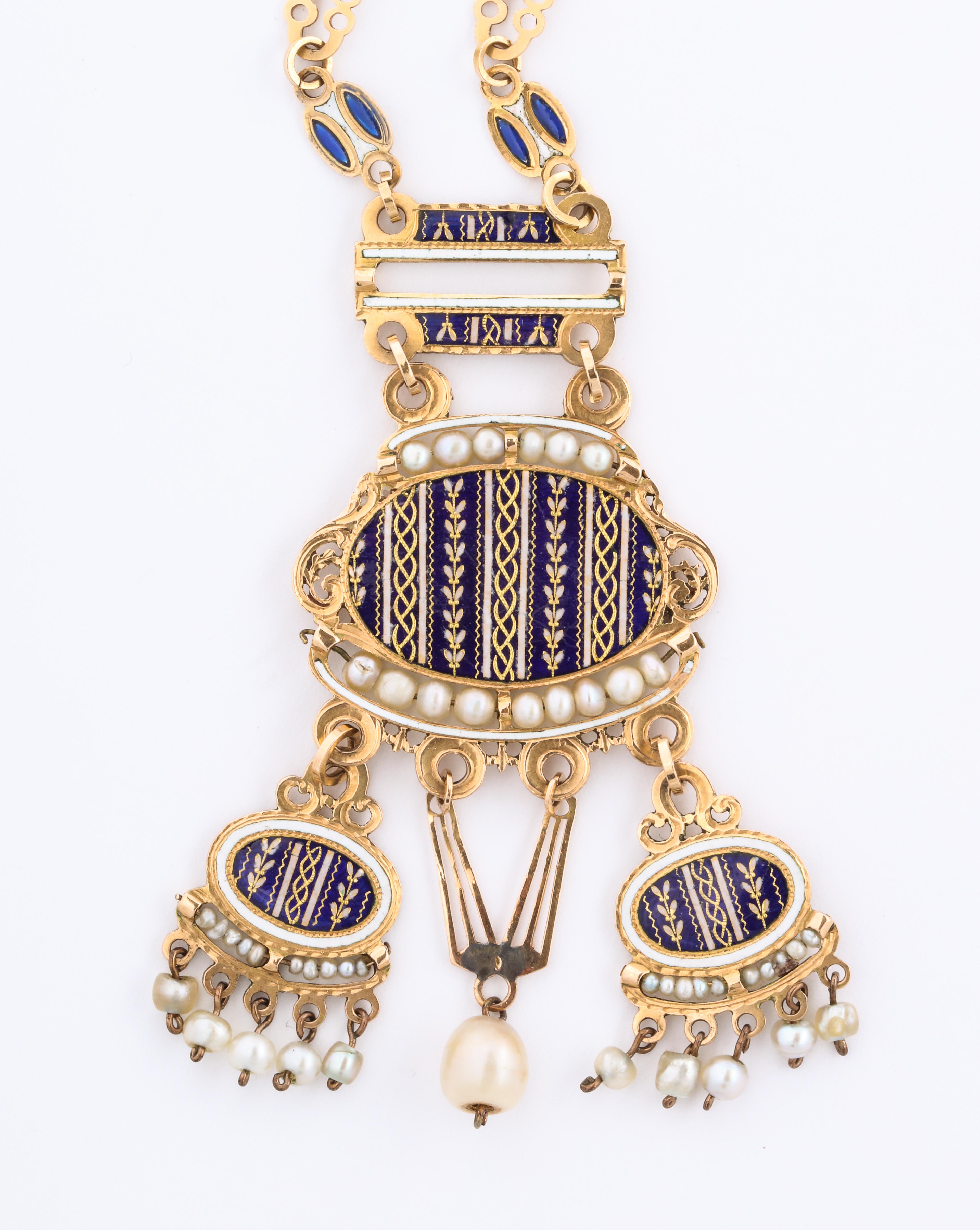 A remarkable and super rare two sided French necklace of 18 kt gold, with enamel and gold  portraits on each side, is in completely original condition.
the necklace is embellished with lustrous natural pearls.  The deep blue landscape on one side
