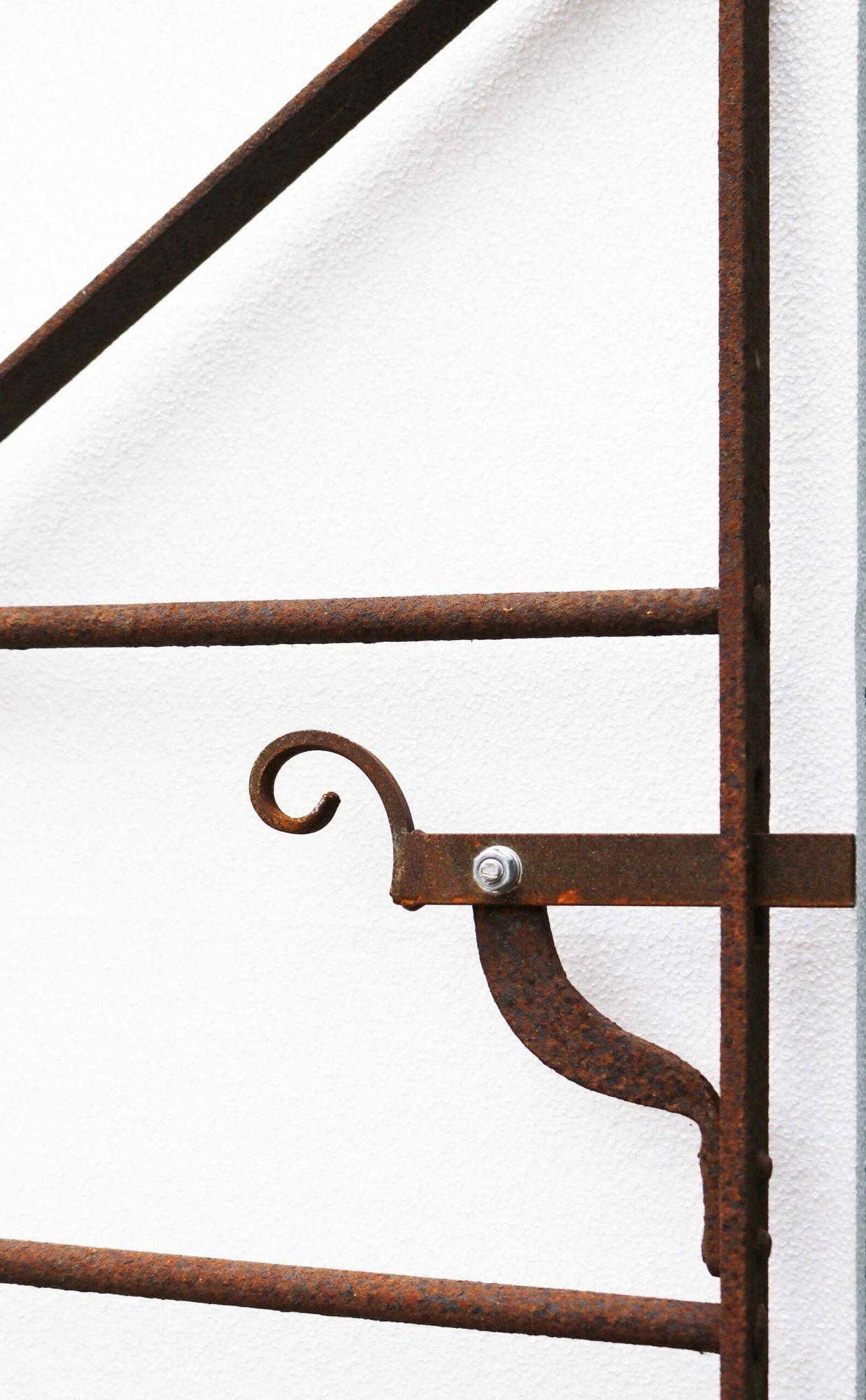 Antique Georgian garden gate. A beautiful regency style gate fitted with a replacement, scroll detailed latch.
 
What is wrought iron?
Wrought iron is a type of refined, low carbon iron that is smelted and worked on with tools. The term wrought
