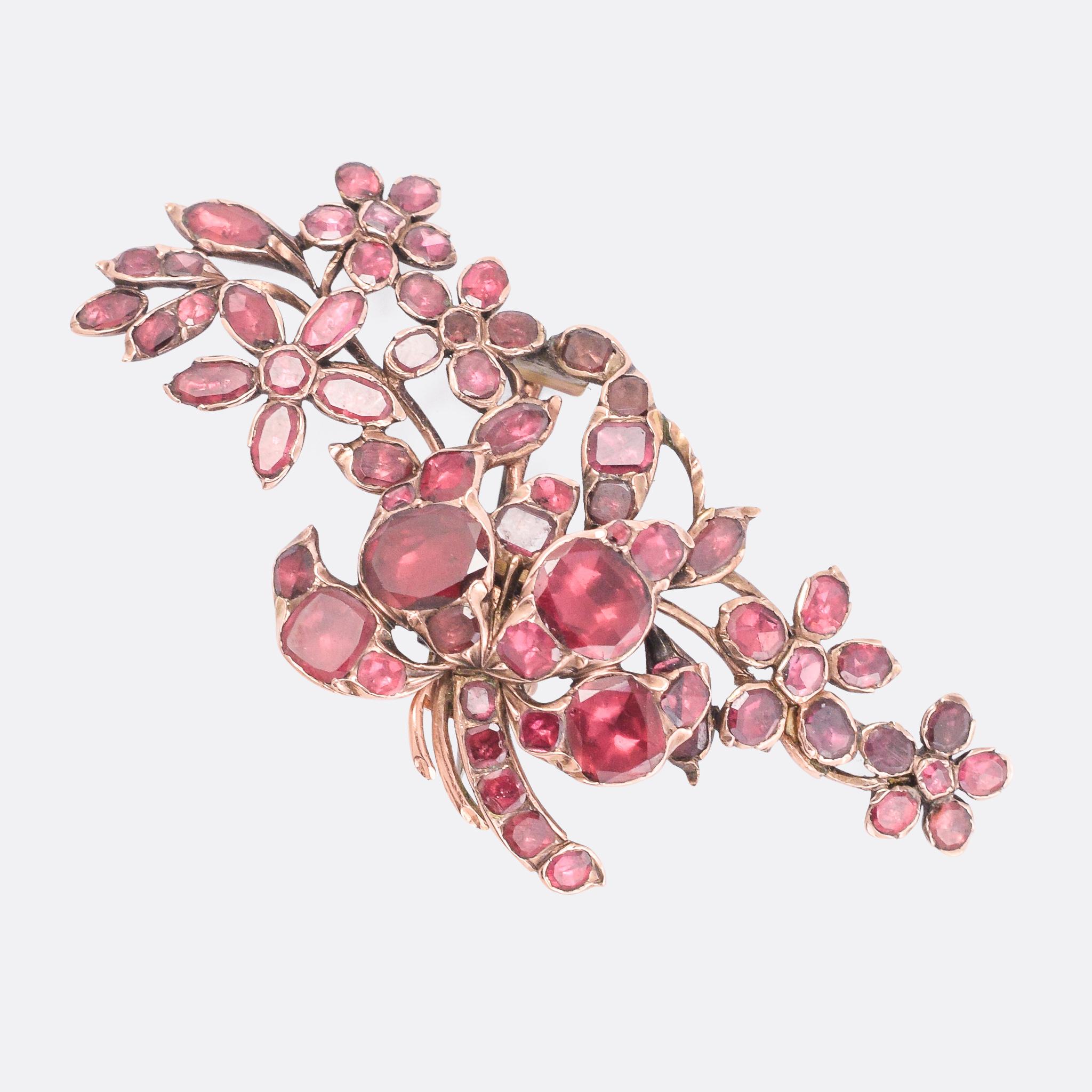 A stunning Georgian Giardinetti Aigrette (aka hair-piece) dating from the late 18th Century, circa 1790. It's set with juicy foil backed garnets, and quite wonderfully depicts a bouquet of flowers. It's skilfully crafted, with bright and vibrant