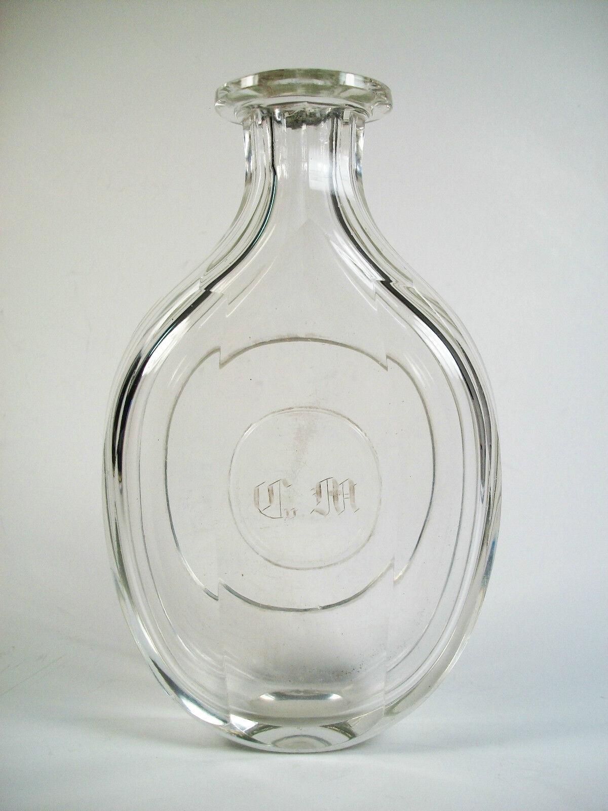 Antique - Georgian period - large wheel cut faceted glass dressing table bottle - Cv.M - monogram in Old English script - United Kingdom (likely) - late 18th/early 19th century.

Good antique condition - missing stopper - surface scratches that