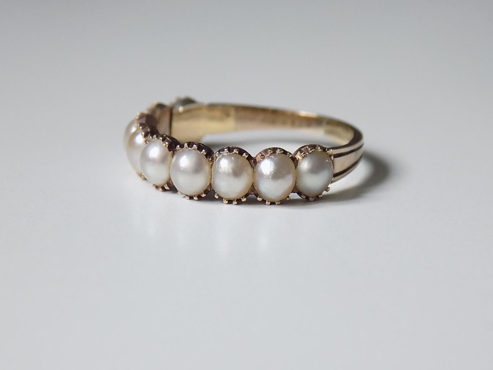 Lovely Georgian c.1800 Gold and split seed Pearl half eternity ring. English origin.
Size N UK, 7 US.
Height of the face 5mm.
Weight 2.2gr.
Unmarked, tested 18 Carat Gold.
The ring has been lovely restored inside of the shank, overall good