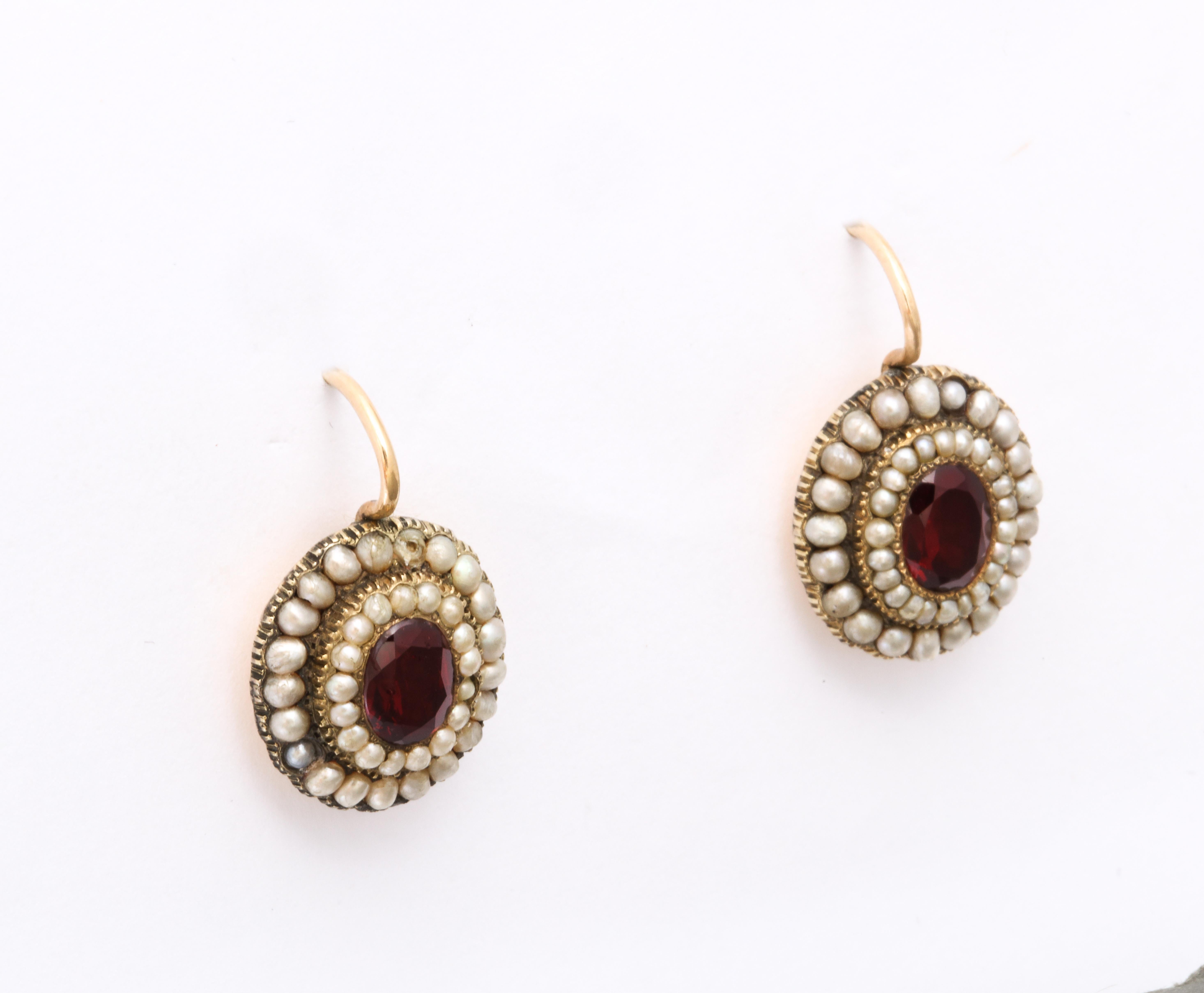 Earrings this size, shape and condition in high karat gold with natural pearls and garnets, are an every day, every occasion accessory of jewelry history. The gold is 15 Kt to 18Kt. Each garnet, Burgundy red, 1.50 cts each, is set in a foiled back