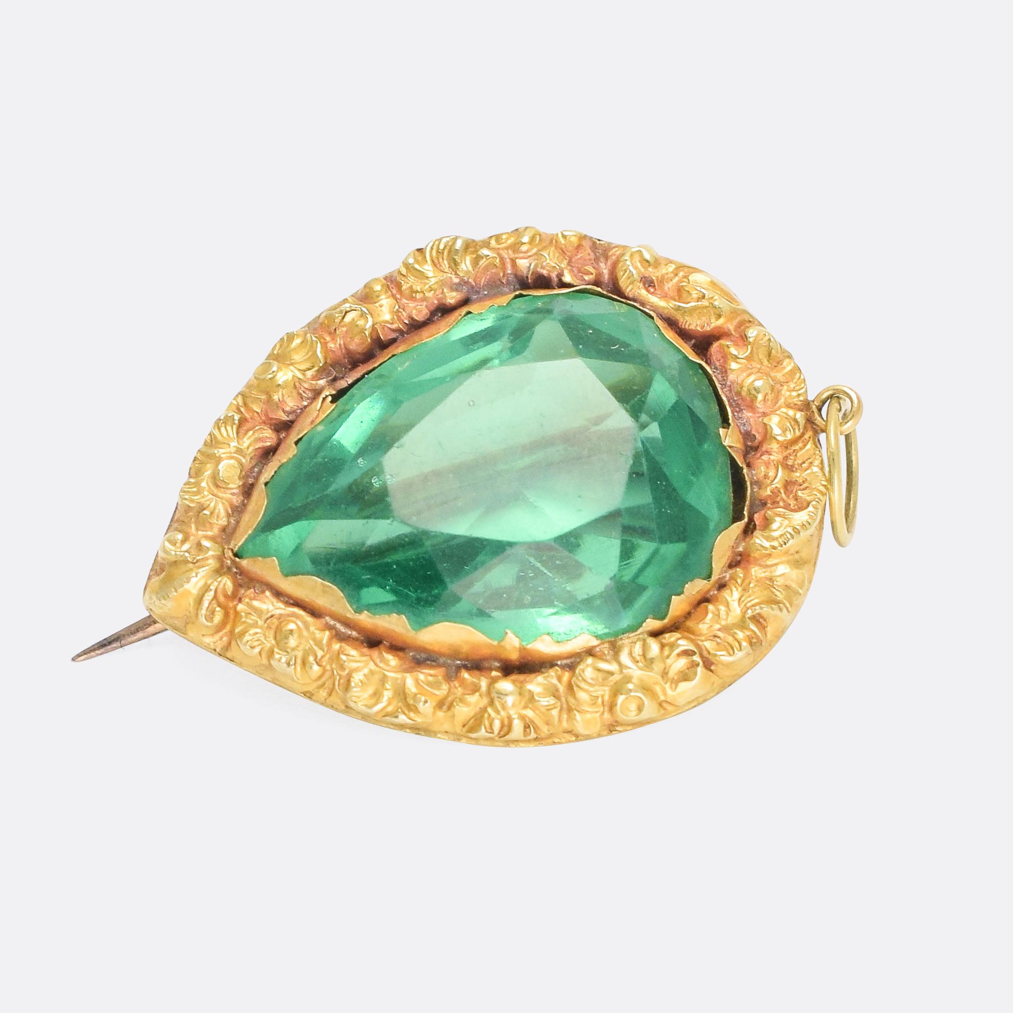 A beautiful antique paste heart pendant / brooch, dating from the early 19th Century circa 1800. The vibrant green stone rests within a highly ornate orange-blossom border, and it's modelled in 15 karat gold throughout.

STONES 
Green Paste - 1.7 x