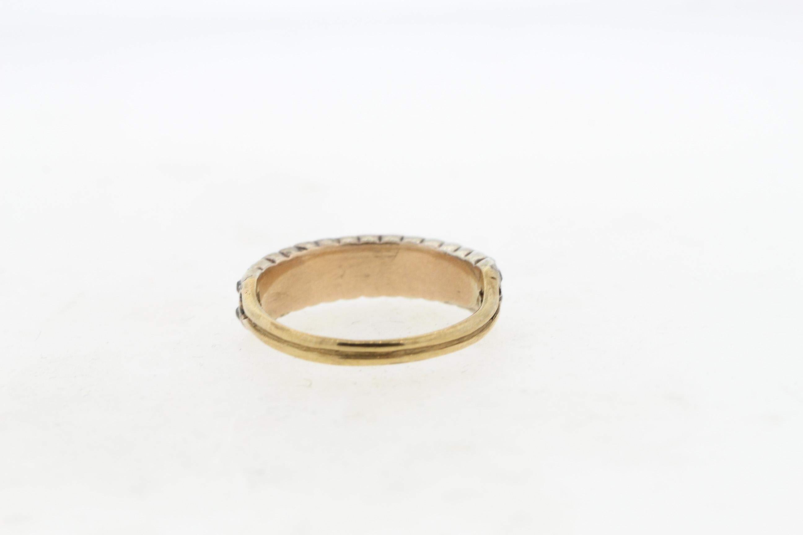 Antique Georgian 15k gold and silver old cut diamond stacking ring, circa 1800. This wearable band is set with 32 Old mine cut diamonds weighing approximately 0.80 carats total. The diamonds are set in a closed back setting, as is typical with