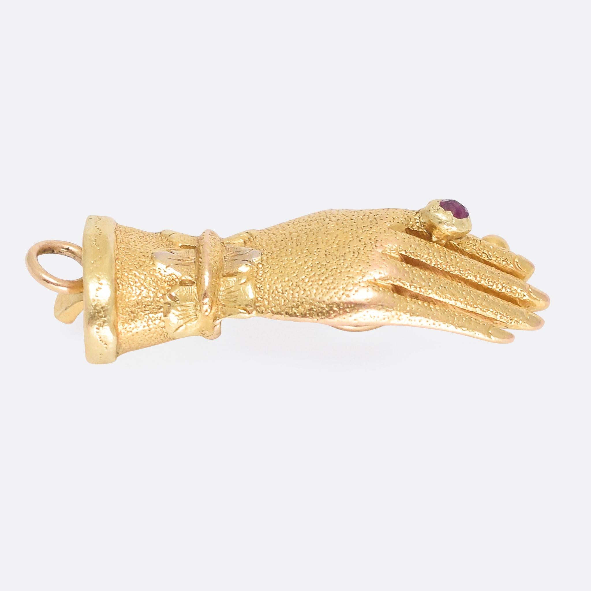 gold hand pendant