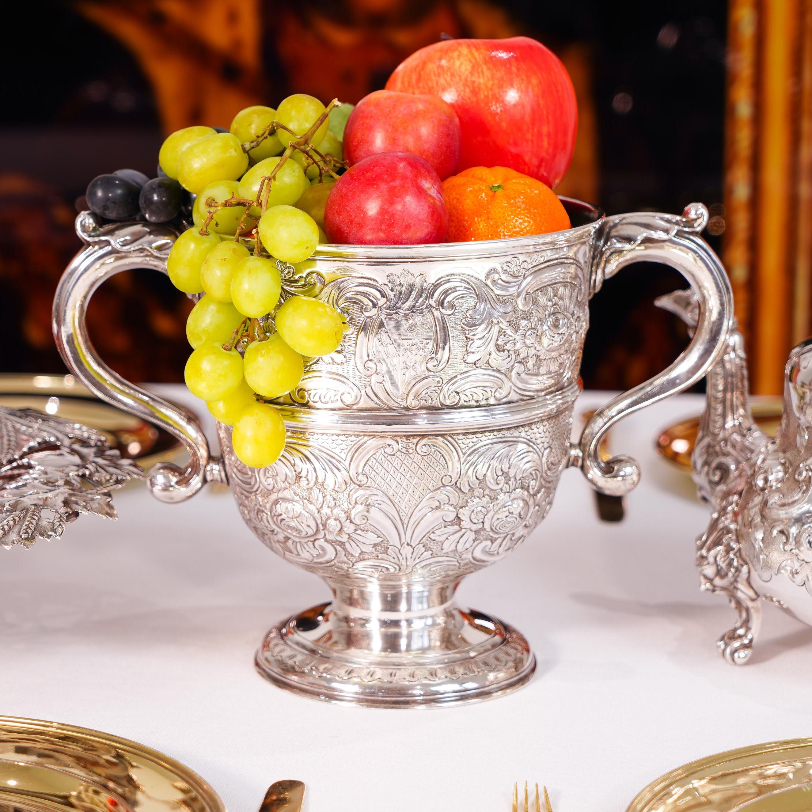 We are delighted to offer this wonderful George I Irish solid silver cup/wine cooler made in Dublin, 1726.

This cup is magnificently decorated and is usually large in size and weight, making for an excellent display centrepiece as part of