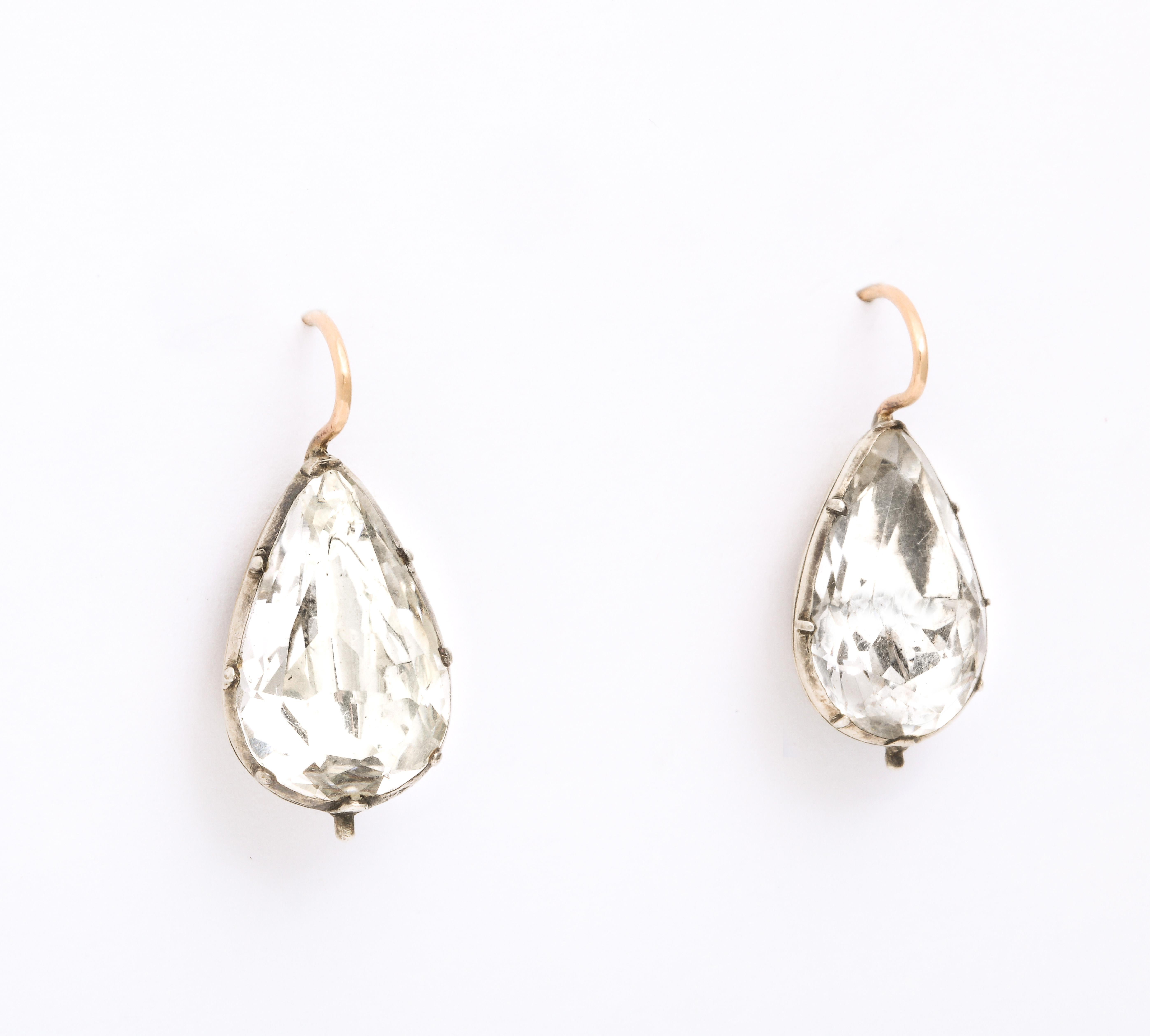 A knockout pair of Georgian Clear Rock Crystal Earrings in an extremely rare 9 to 10 ct size. The earrings are teardrop or pear shape set in rounded closed, foiled settings typical of Georgian earrings of this period. Magnificent, rare in size and