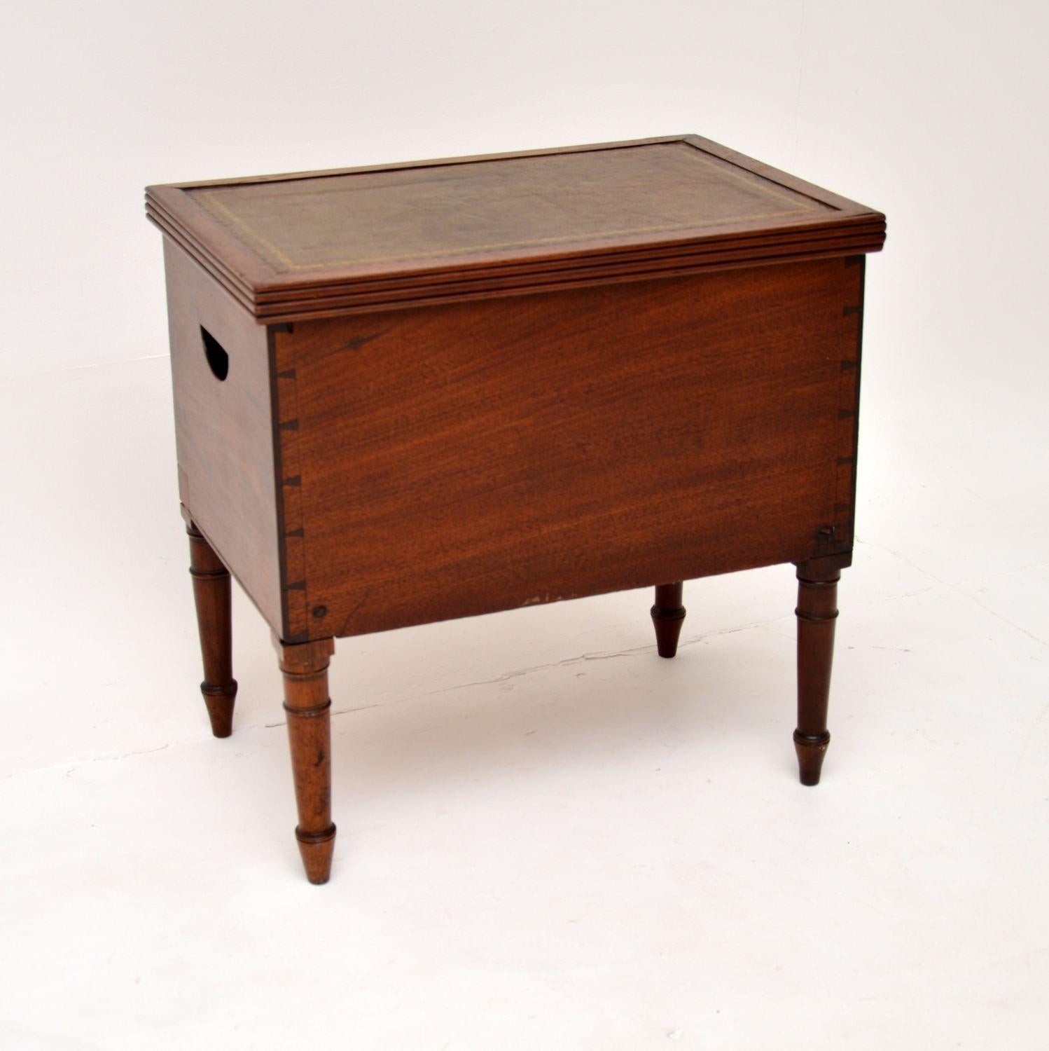 A most unusual and useful antique Georgian leather top storage box on legs. This was made in England, it dates from the 1800-1820 period.

It is beautifully made from solid wood, there is inlaid satin wood banding on the front, the back has exposed