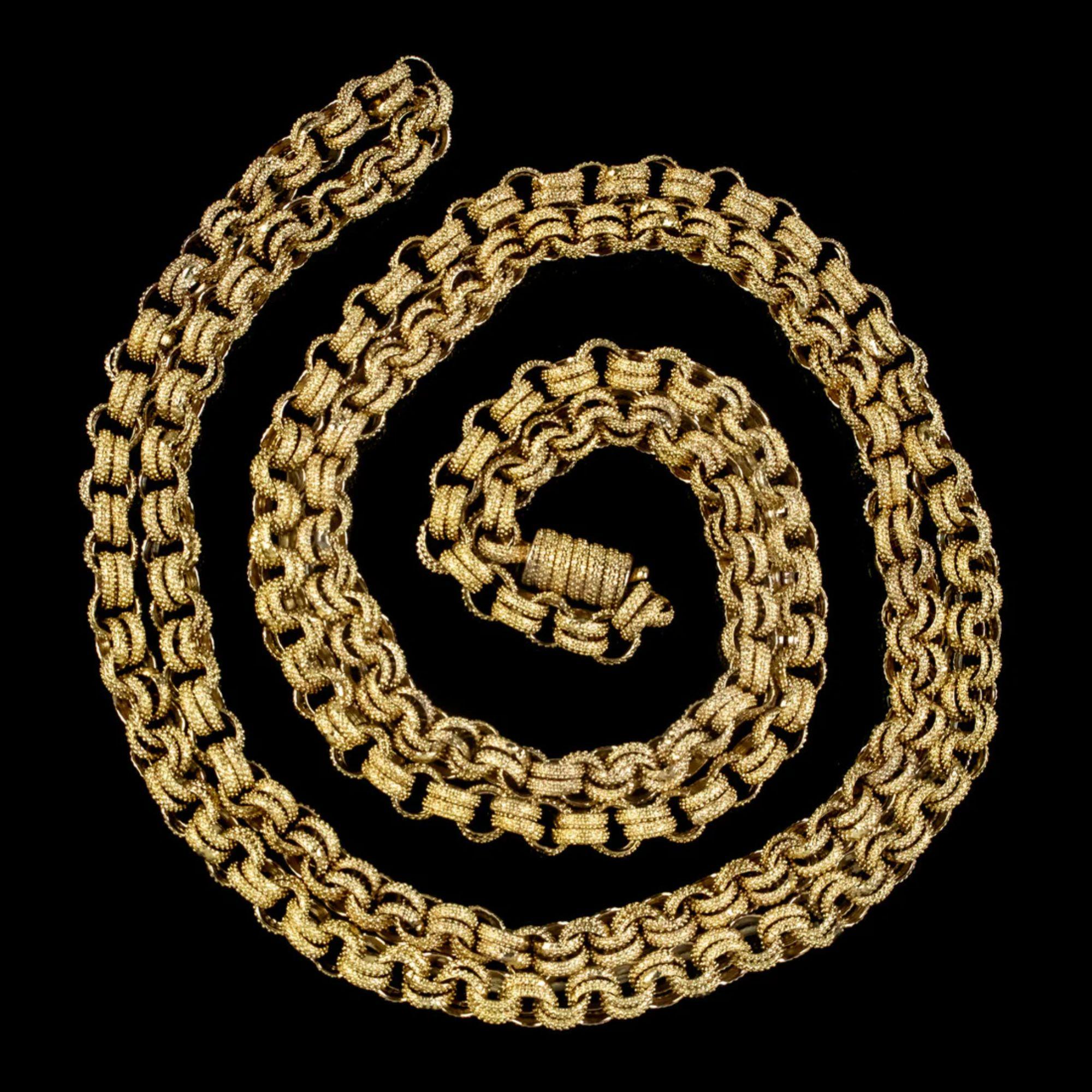 A grand antique Georgian chain beautifully preserved from the early 19th Century. It’s made up of pinchbeck cable links, gilded in 18ct yellow gold with a wonderful bumpy texture across the surface.

It measures an impressive 39 inches in length and