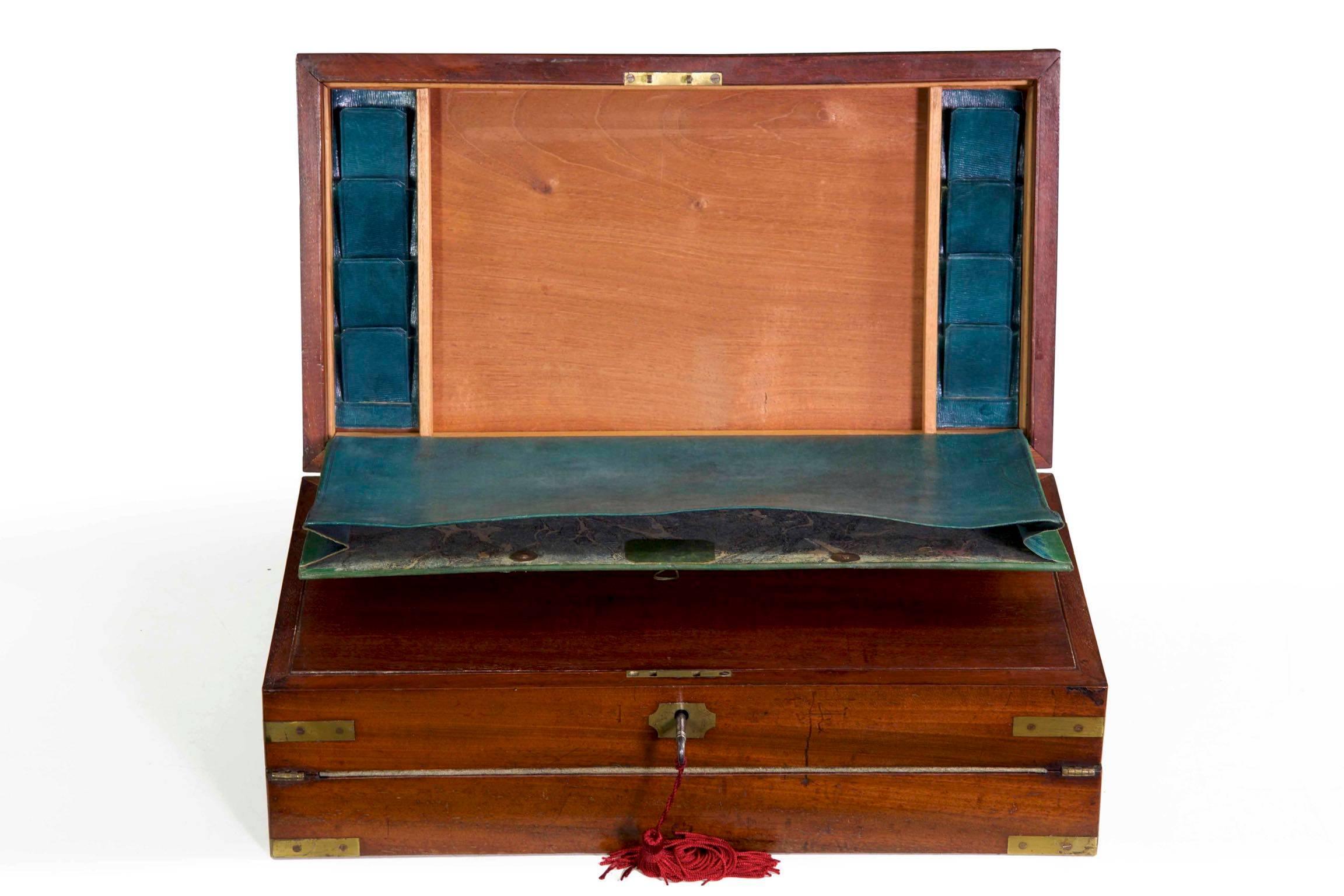 A Fine triple-opening Georgian brass-bound mahogany writing slope with high quality brass fittings, this configuration is often referred to as a Captain’s box and offers a full suite of office organization in its lean and angular profile. The top