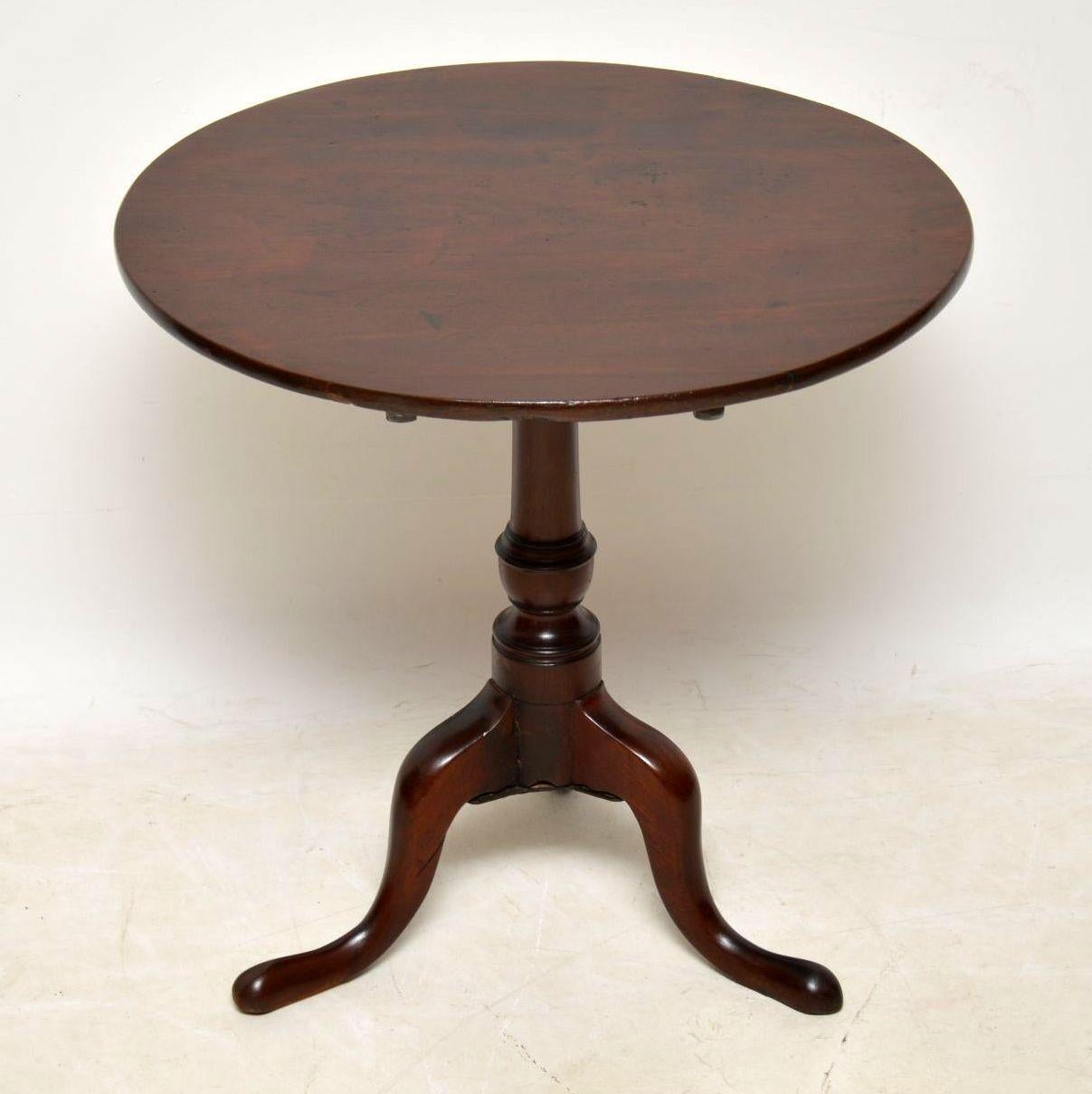 Antique George III solid mahogany period table in good condition and dating from circa 1790 period or possibly a bit earlier. This table has a tilt mechanism and as you can see from the images, it all looks original. It has good proportions and