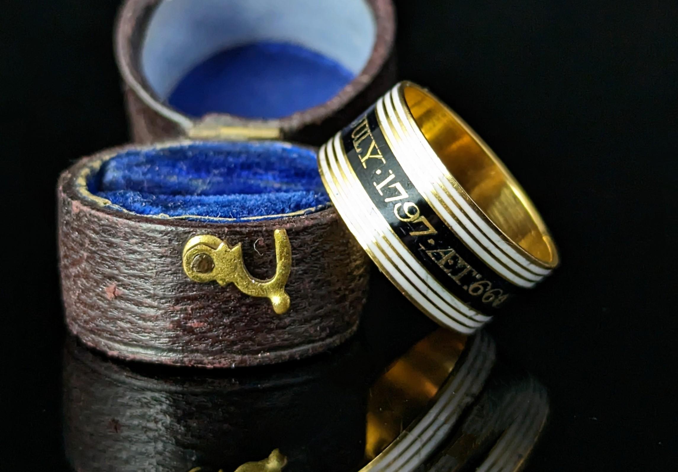 You cannot help but be enchanted by the beauty and emotion of this stunning antique Georgian mourning band ring.

The ring is a very rich 22ct yellow gold, enamelled in black with white enamel bands top and bottom, it is a lovely wide band and a