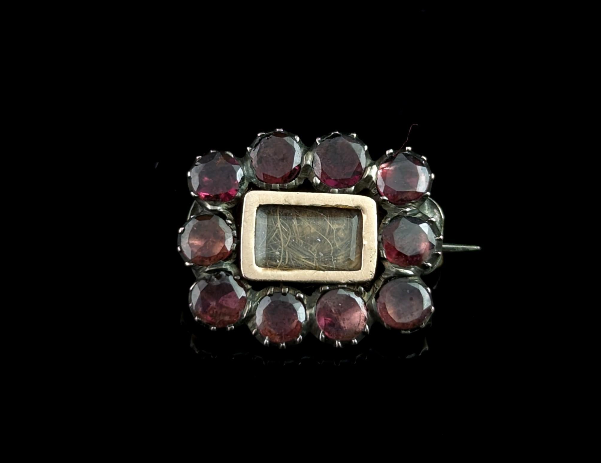 The Georgians were a sentimental bunch and it shows, not least in their beautiful Mourning pieces.

This sweet antique Mourning brooch or lace pin is a typical design of the Georgian era that remained popular throughout the 19th century.

It is a