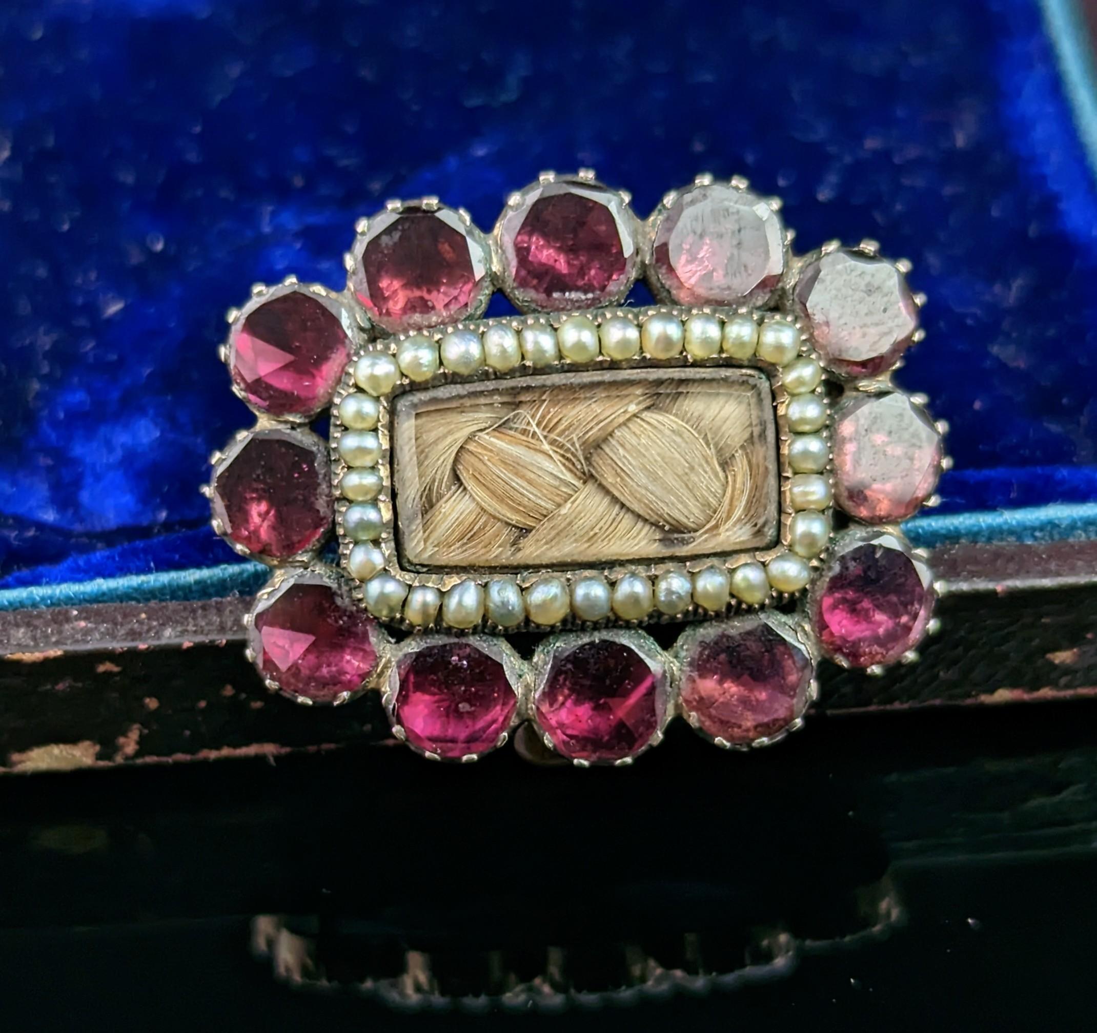 The Georgians were very sentimental and it shows in the jewellery from the era, not least in their beautiful Mourning pieces.

This sweet antique Mourning brooch is a typical design of the Georgian era that remained popular throughout the 19th