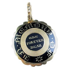 Antique Georgian mourning locket pendant, 9k gold and black enamel