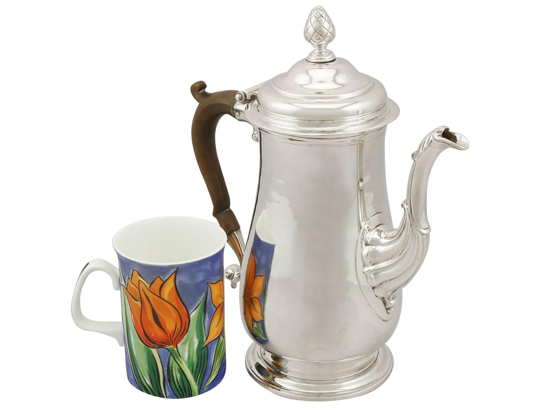 An exceptional, fine and impressive antique George II Newcastle sterling silver coffee pot; an addition to our Georgian silver teaware collection.

This exceptional antique George II Newcastle sterling silver coffee pot has a baluster shaped form