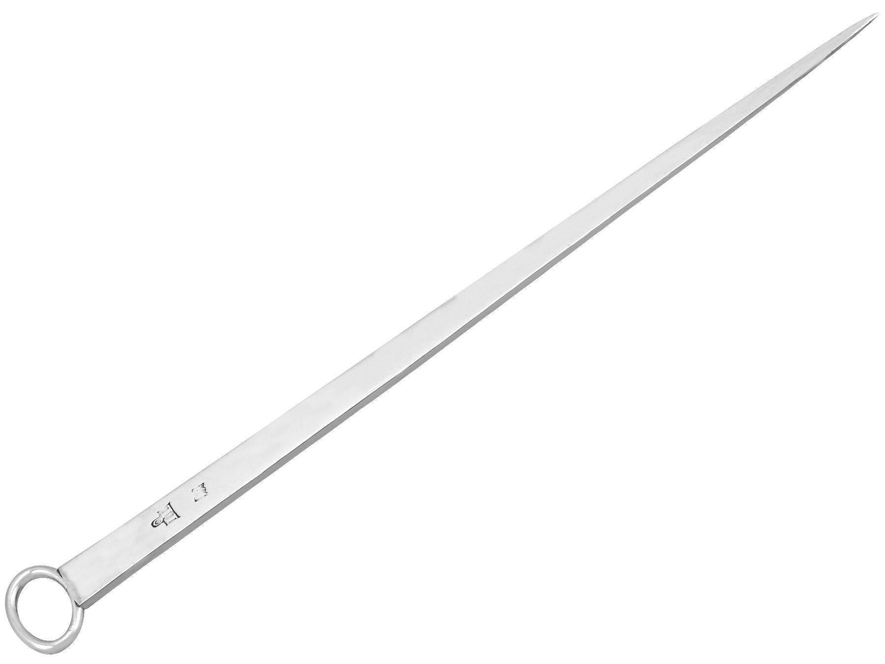 An exceptional, fine and impressive antique Georgian Newcastle sterling silver meat skewer/letter opener; an addition to our diverse 18th century flatware collection

This antique Georgian sterling silver meat skewer/letter opener* has a tapered