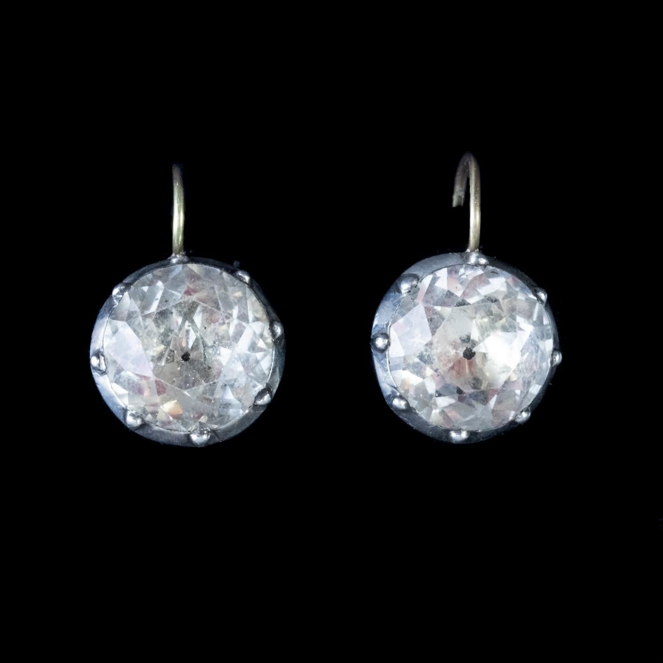 These fantastic Antique Georgian earrings feature stunning old cut Paste stones weighing over 5ct each, set in Silver backed galleries. They also come with gorgeous and secure 18ct wires.

Paste is a heavy, transparent flint glass that simulates the