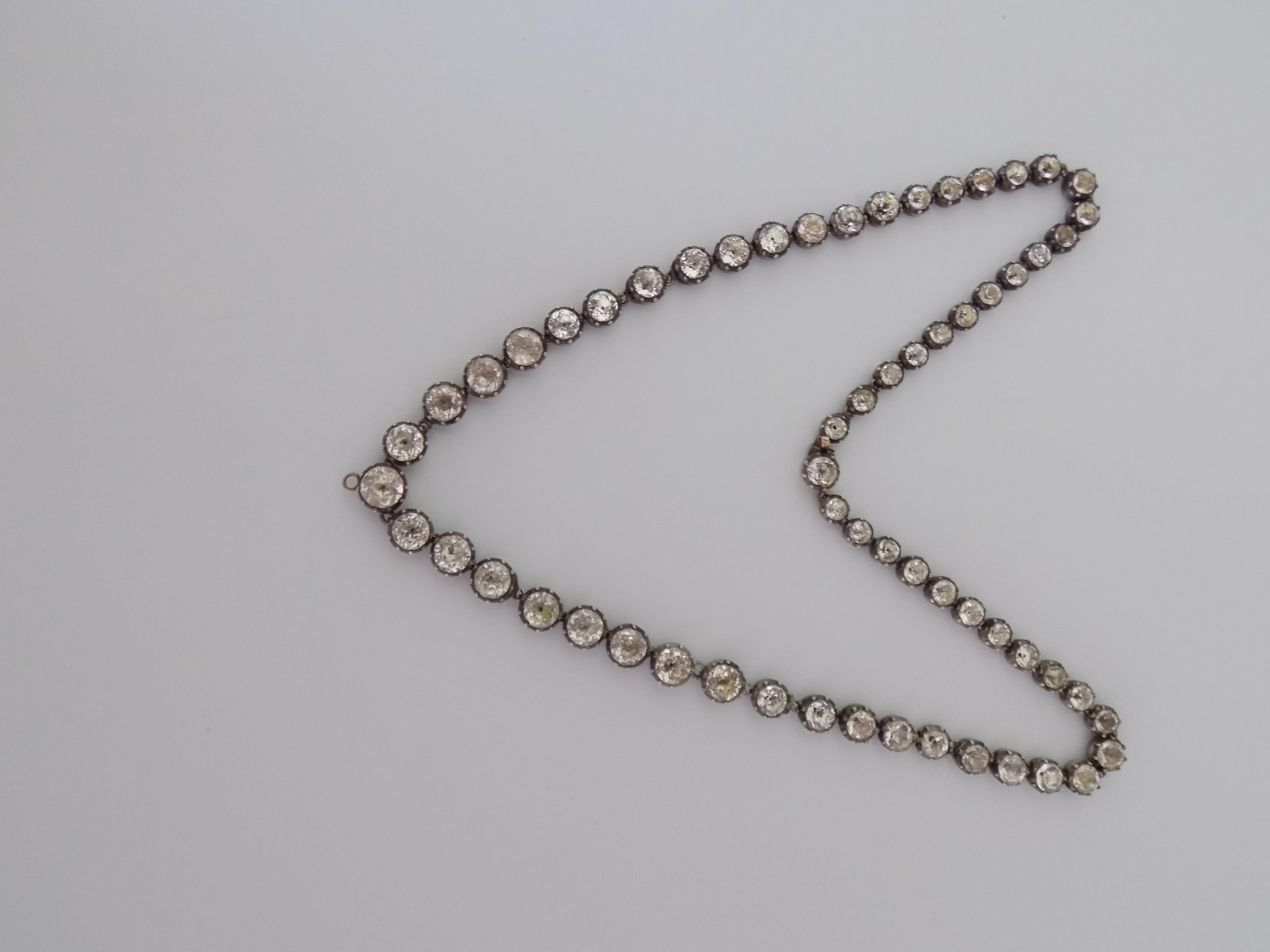 An Outstanding Georgian c.1800s Silver and hand cut, foil backed black dot Paste RIVIERE Necklace. The necklace has gold finish to protect skin from the Silver tarnish. English origin. Looks amazing when worn.
Total length of the necklace including