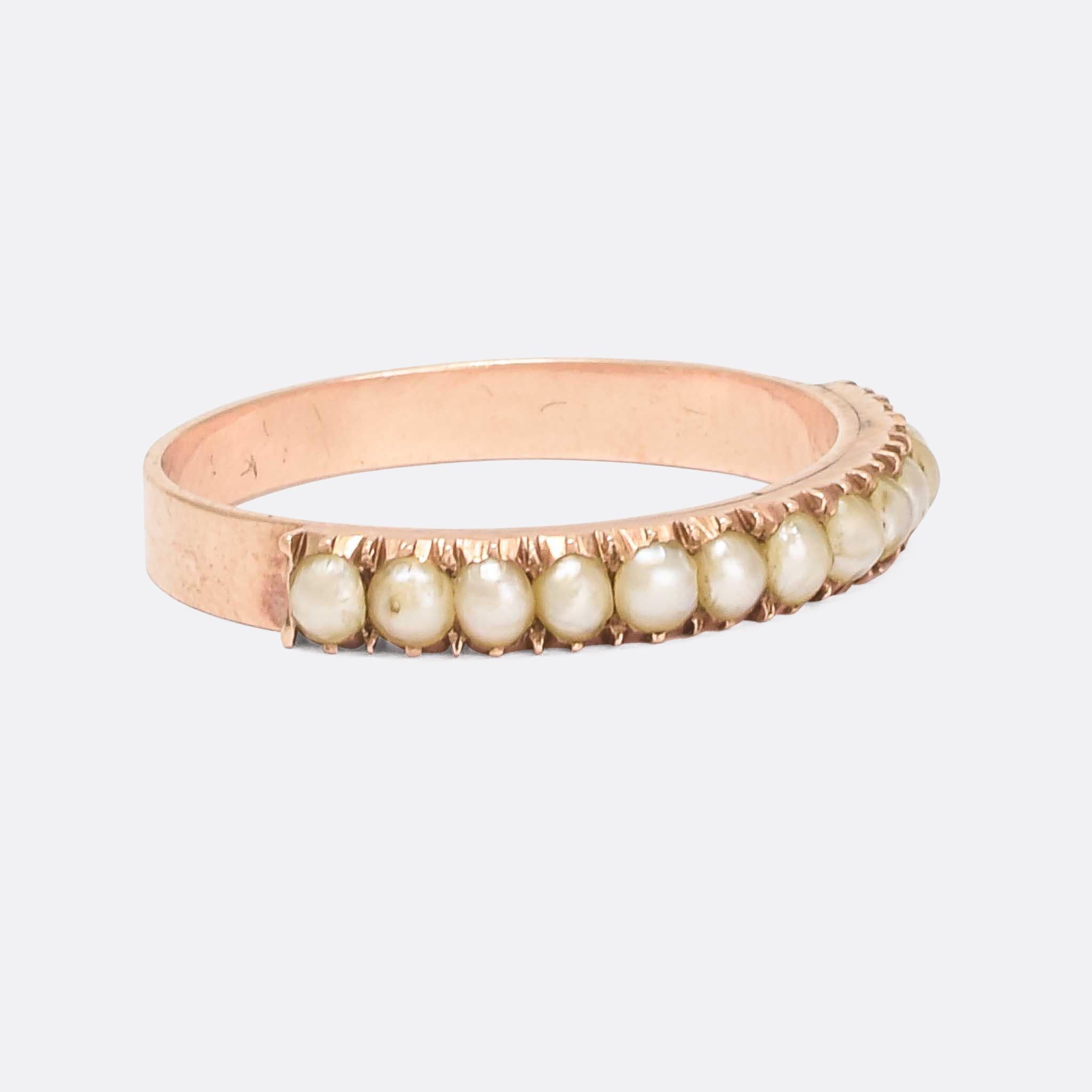 Gorgeous late Georgian pearl half-hoop dating from the 1830s. It's modelled in 15 karat rose gold, with flat band and cut-down pie crust settings. The slim profile makes it ideal for stacking.

STONES 
Pearl

RING SIZE
8.5 US

MEASUREMENTS 
Width at