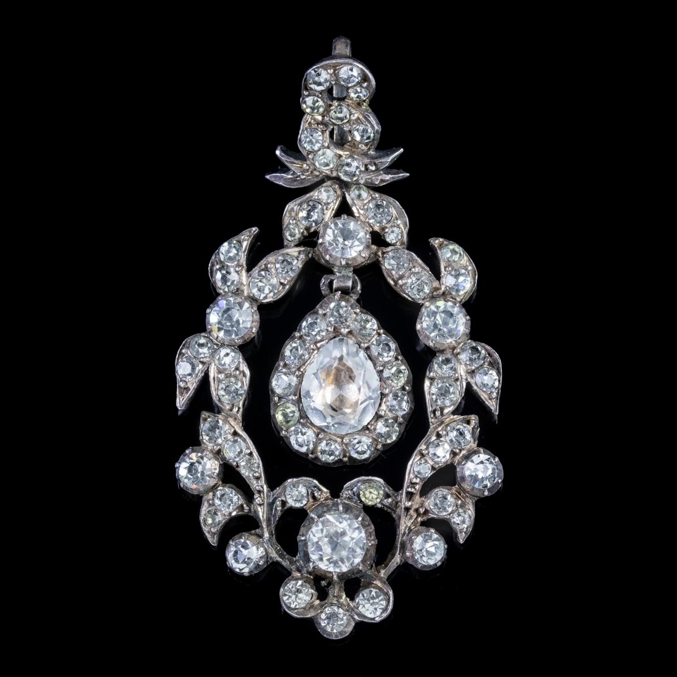 An exquisite antique pendant, beautifully preserved from the Georgian era and decorated with sparkling white Paste Stones with a fabulous swinging teardrop dropper at its heart with a larger foil backed Paste in the centre. 

Paste is a transparent