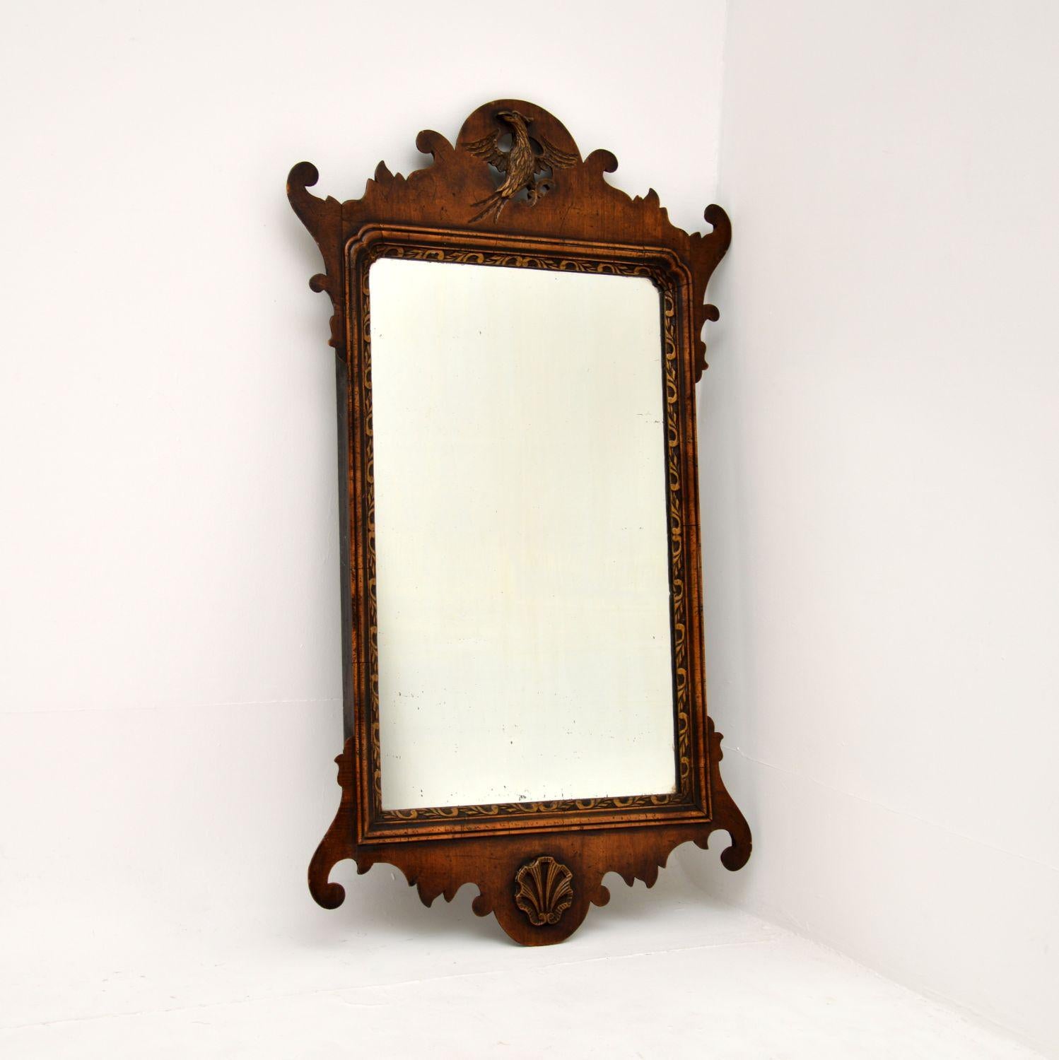 A stunning original antique Georgian period carved walnut mirror. This was made in England, it dates from around the 1790-1810 period.

It is beautifully designed and of amazing quality. The frame has fantastic, crisp carving throughout, including
