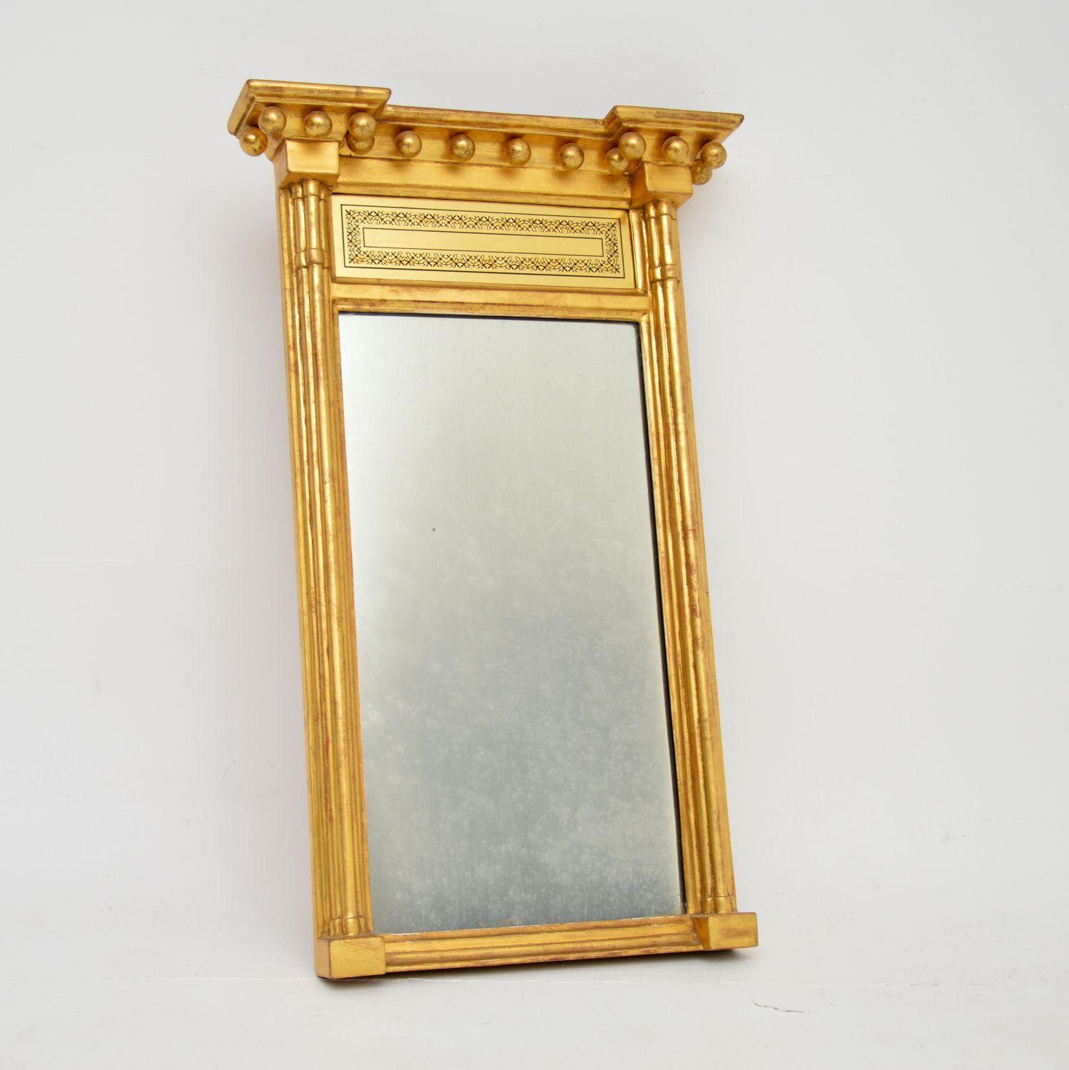 A rare & small original George III period gilt wood mirror in the neoclassical style. This was made in England & I would date it from around the 1790-1810 period.

It is of extremely fine quality and is a lovely size. The cornice is beautifully