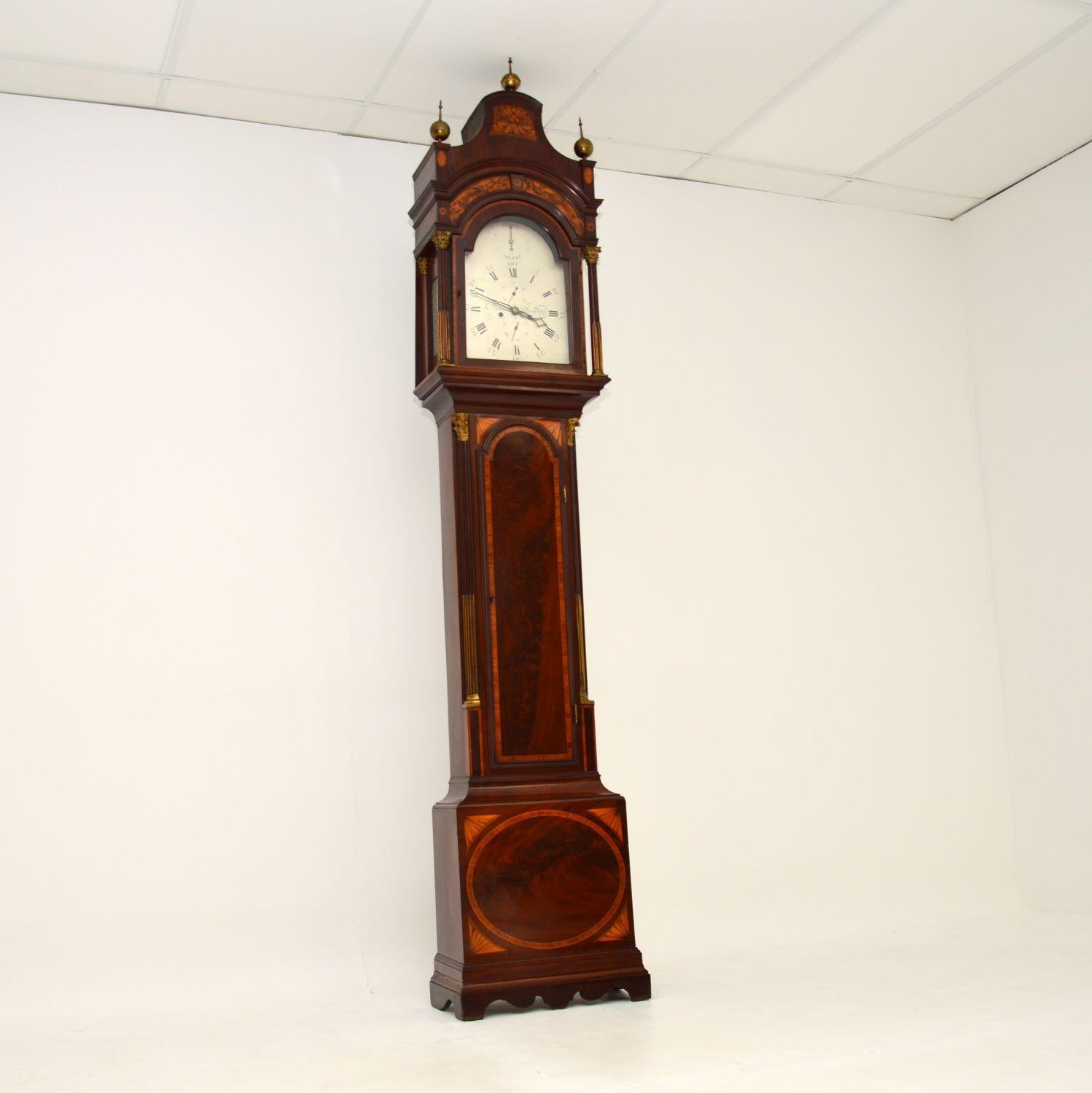 An excellent and very rare antique Georgian long case grandfather clock, beautifully made from inlaid wood. This case was made by the well known clock case maker Richard Reeves in England, it can be dated from 1800-1810. The original label can be