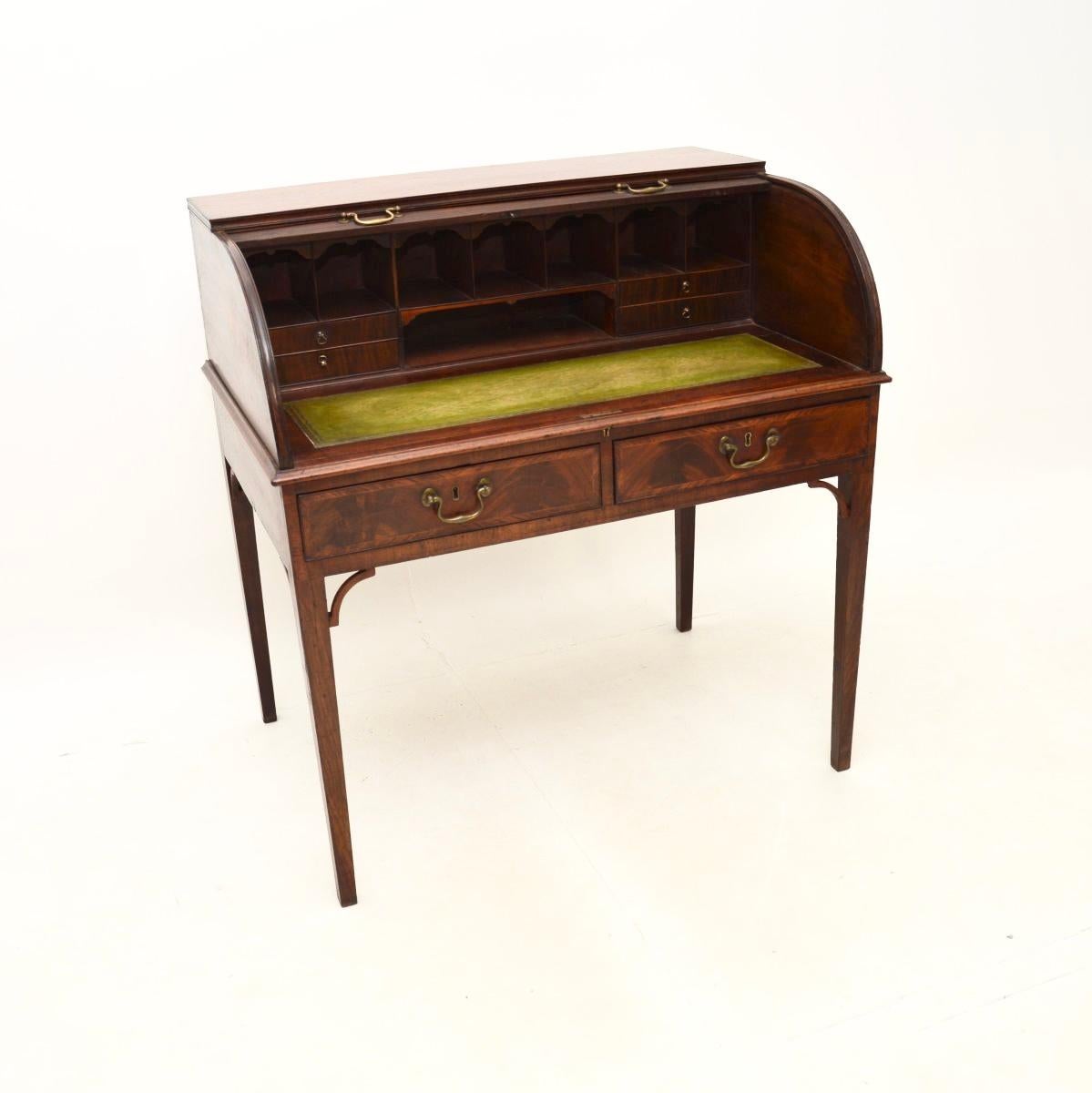A fantastic antique Georgian period tambour top desk. This was made in England, we would date it from around the 1790-1810 period.

The quality is superb, this is beautifully styled and elegant. It stands on tapered legs with two drawers beneath the