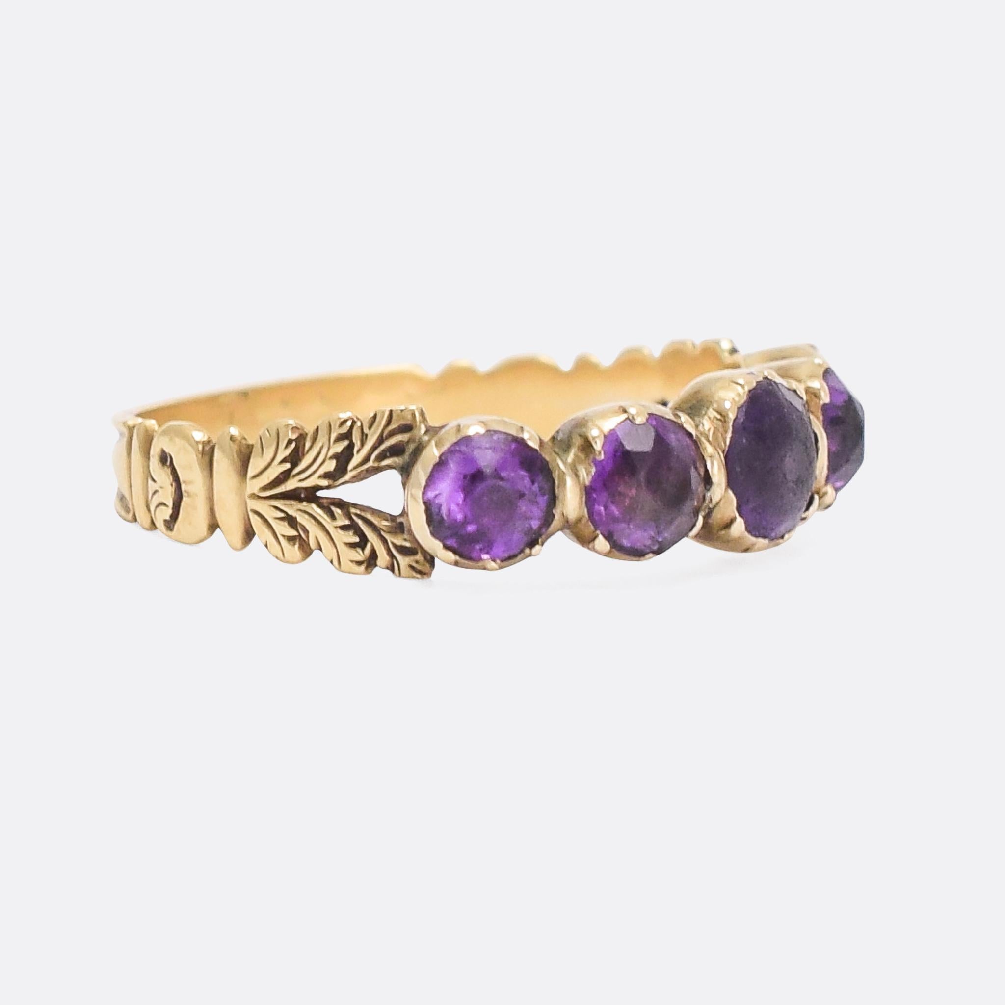 An elegant Georgian half-hoop band set with purple paste stones in foiled settings. The bifurcated shoulders have been adorned with intricate hand-chased detailing, joined to the band with a scrolled flourish. The foil behind the stones really